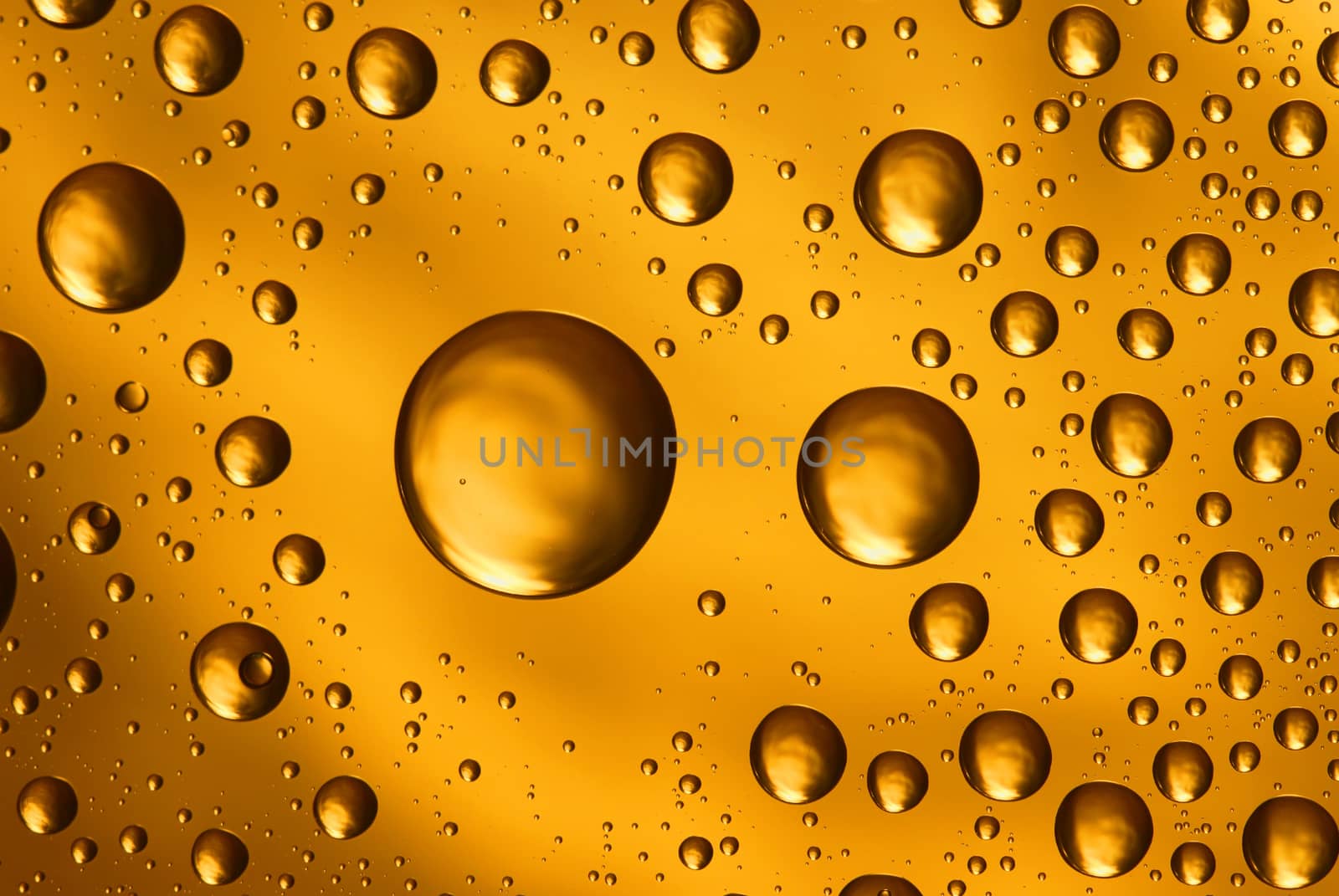 golden water drops on glass,could be used as background