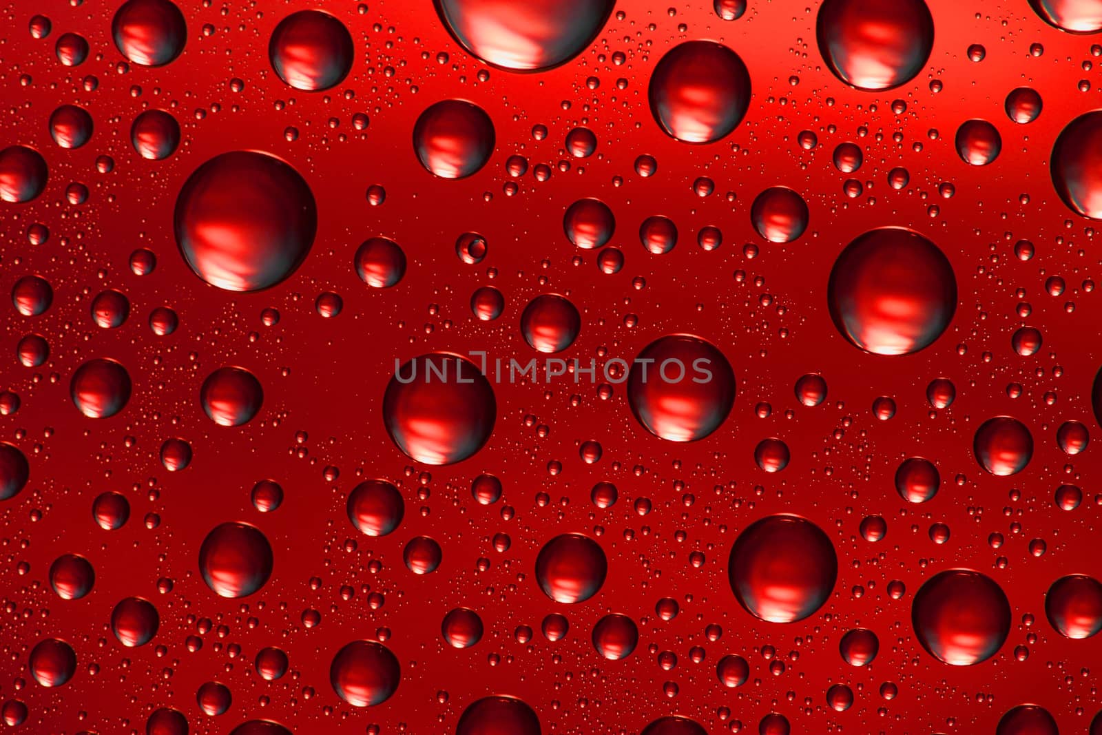 red water drops on glass,could be used as background