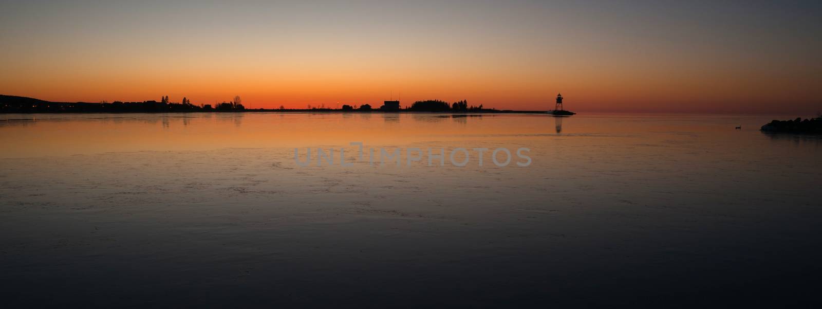 It's still winter here in the harbor at Grand Marais with thin ice on the water at sunset