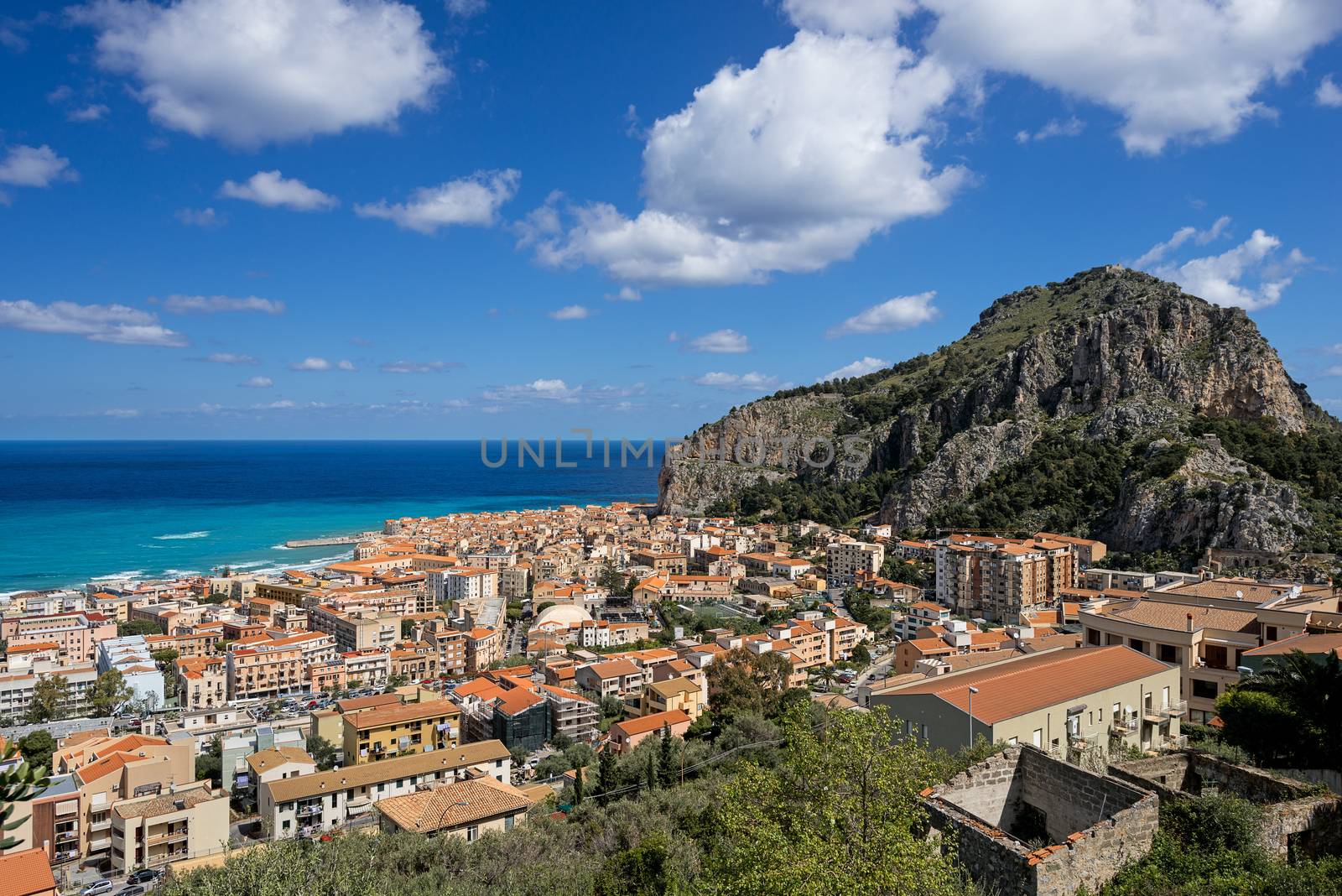 Bay in Cefalu Sicily city and hill by Nanisimova