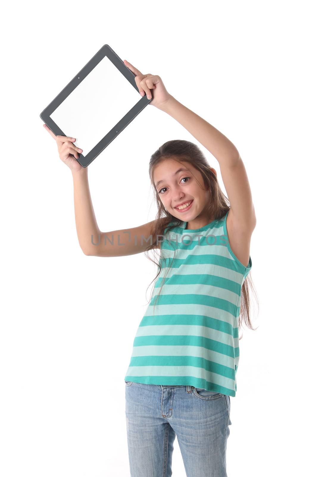 Beautiful pre-teen girl with a tablet computer. by Erdosain