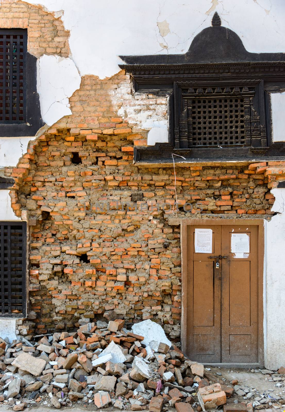 KATHMANDU, NEPAL - MAY 14, 2015: Detail of a damaged facade on Durbar Square which was partially destroyed after two major earthquakes hit Nepal in the past weeks.