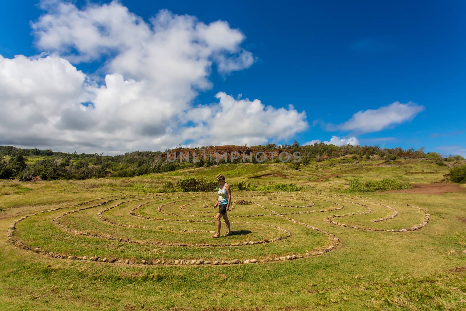 Woman doing walking meditation in labyrinth near Dragon's Teeth