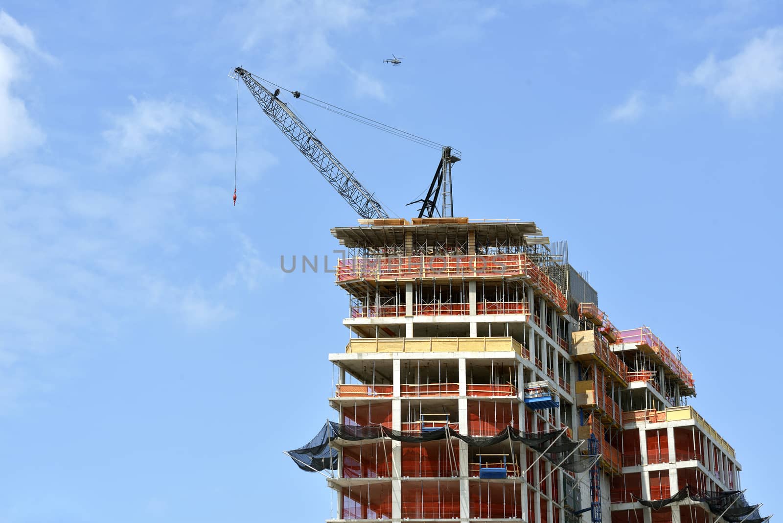 Building under construction a blue sky day by Hbak