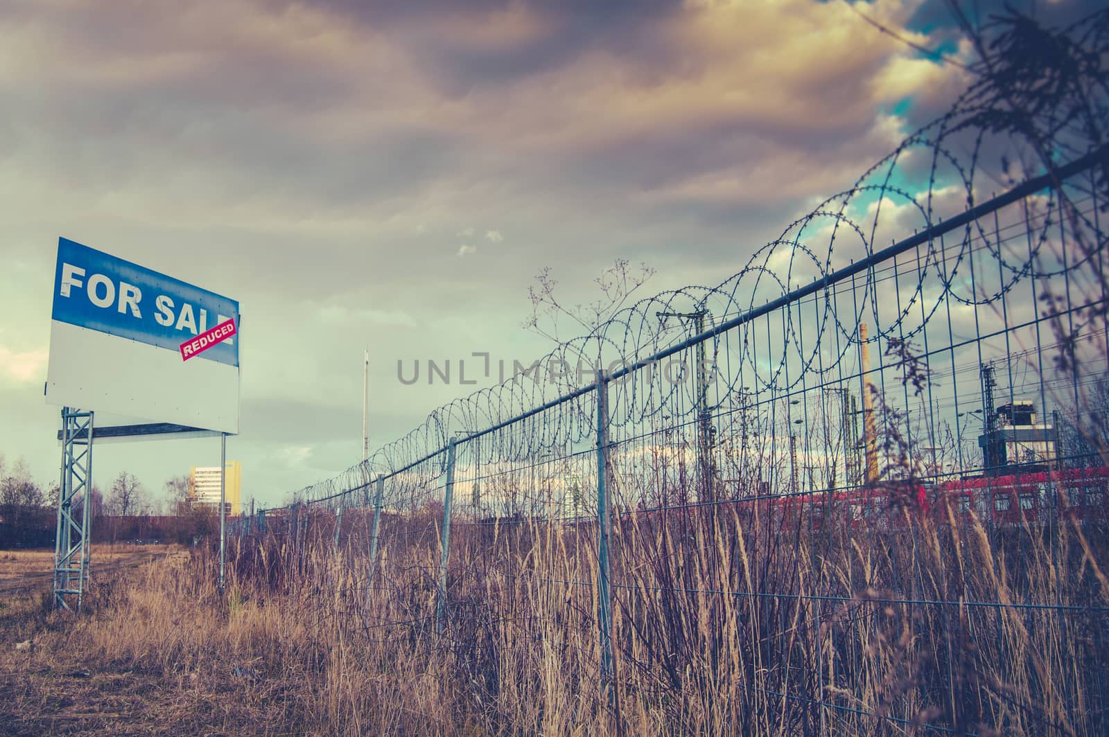 A For Sale Billboard Sign In An Urban Industrial Wasteland Or Vacant Lot