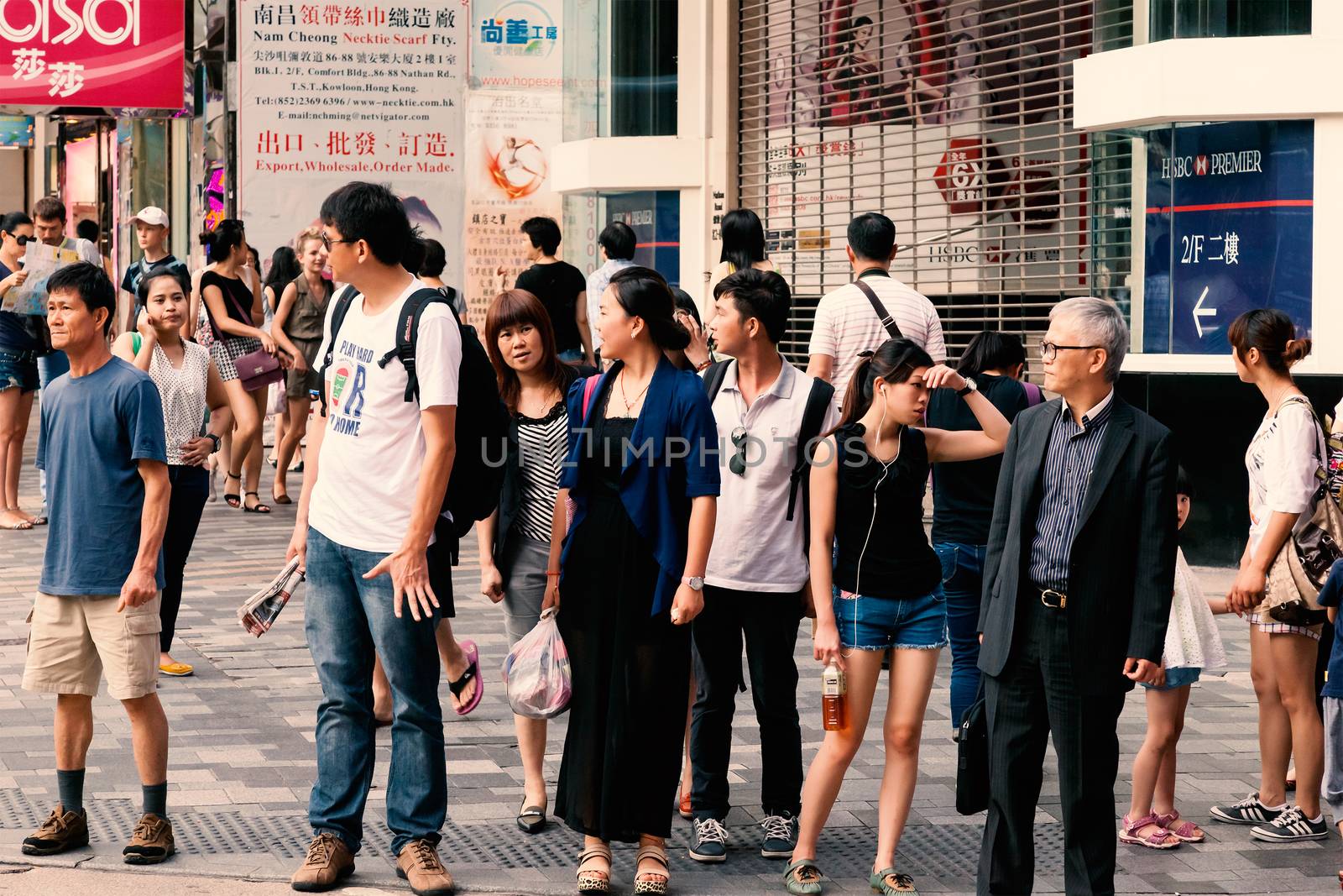 People waiting for the bus, Chungking Mansions, Nathan Road, Hong kong, China, 21 june, 2013.