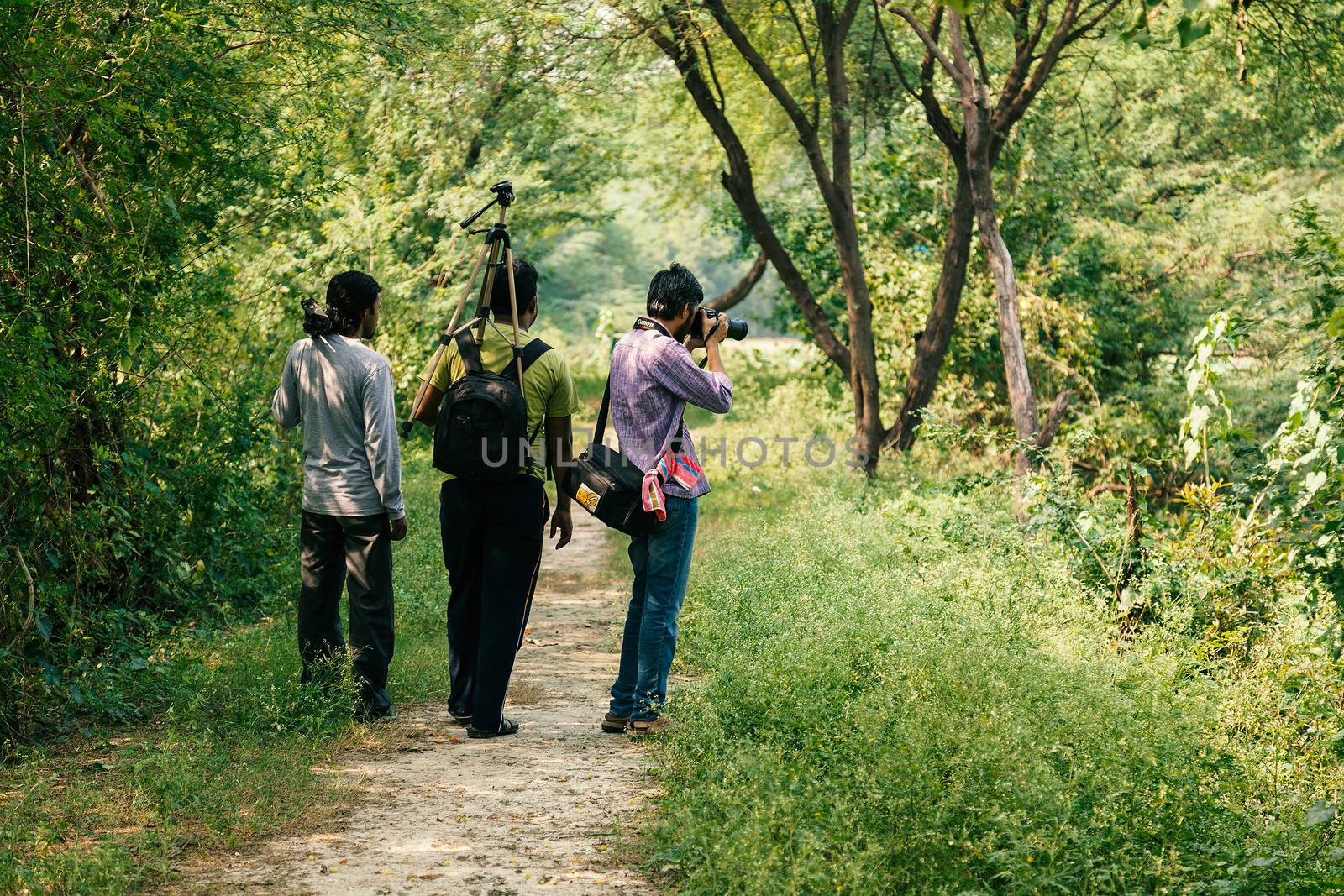 Indian photography lovers in outdoor, taking photos. with tripod.