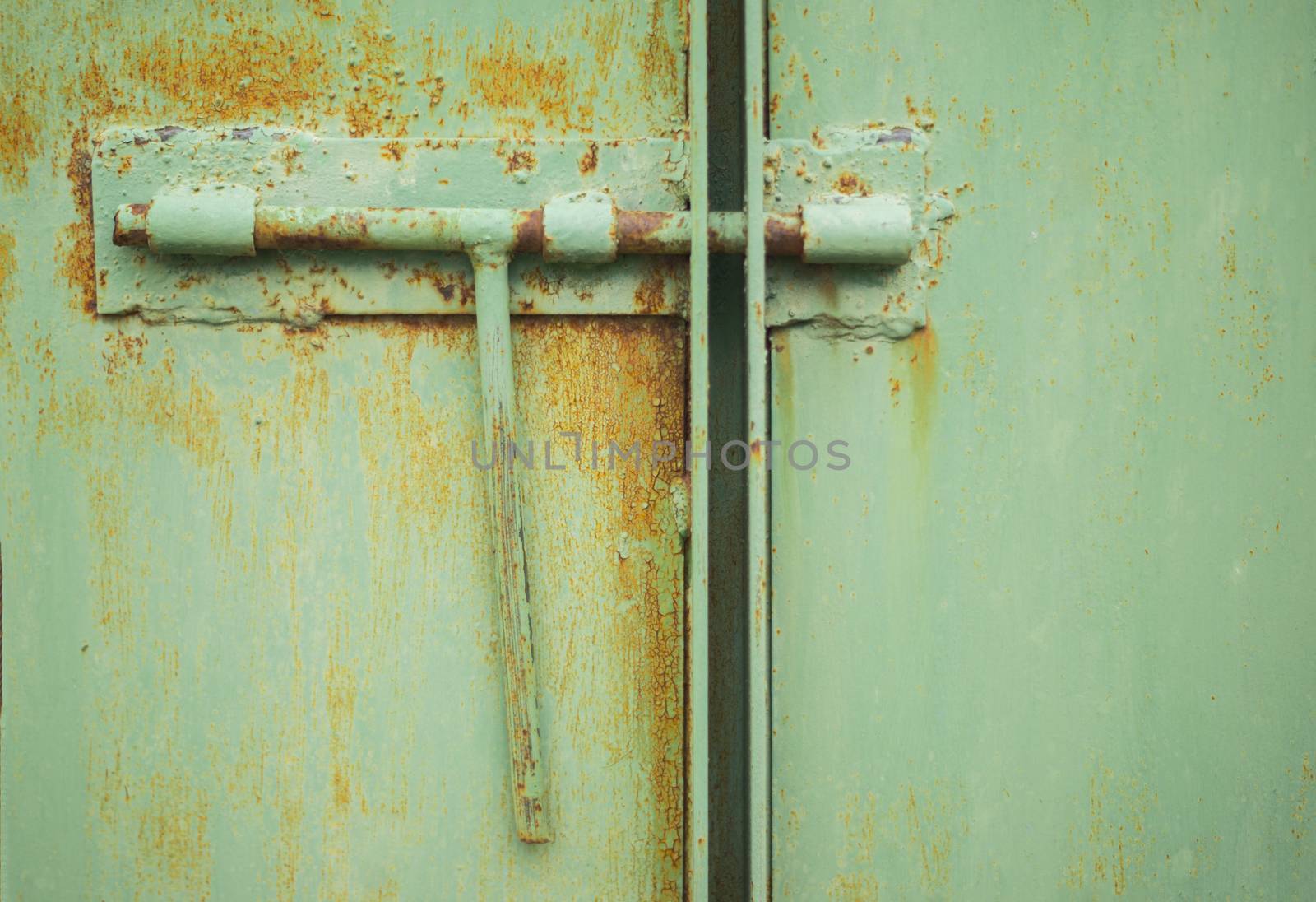 lock on rusty iron door. For your commercial and editorial use