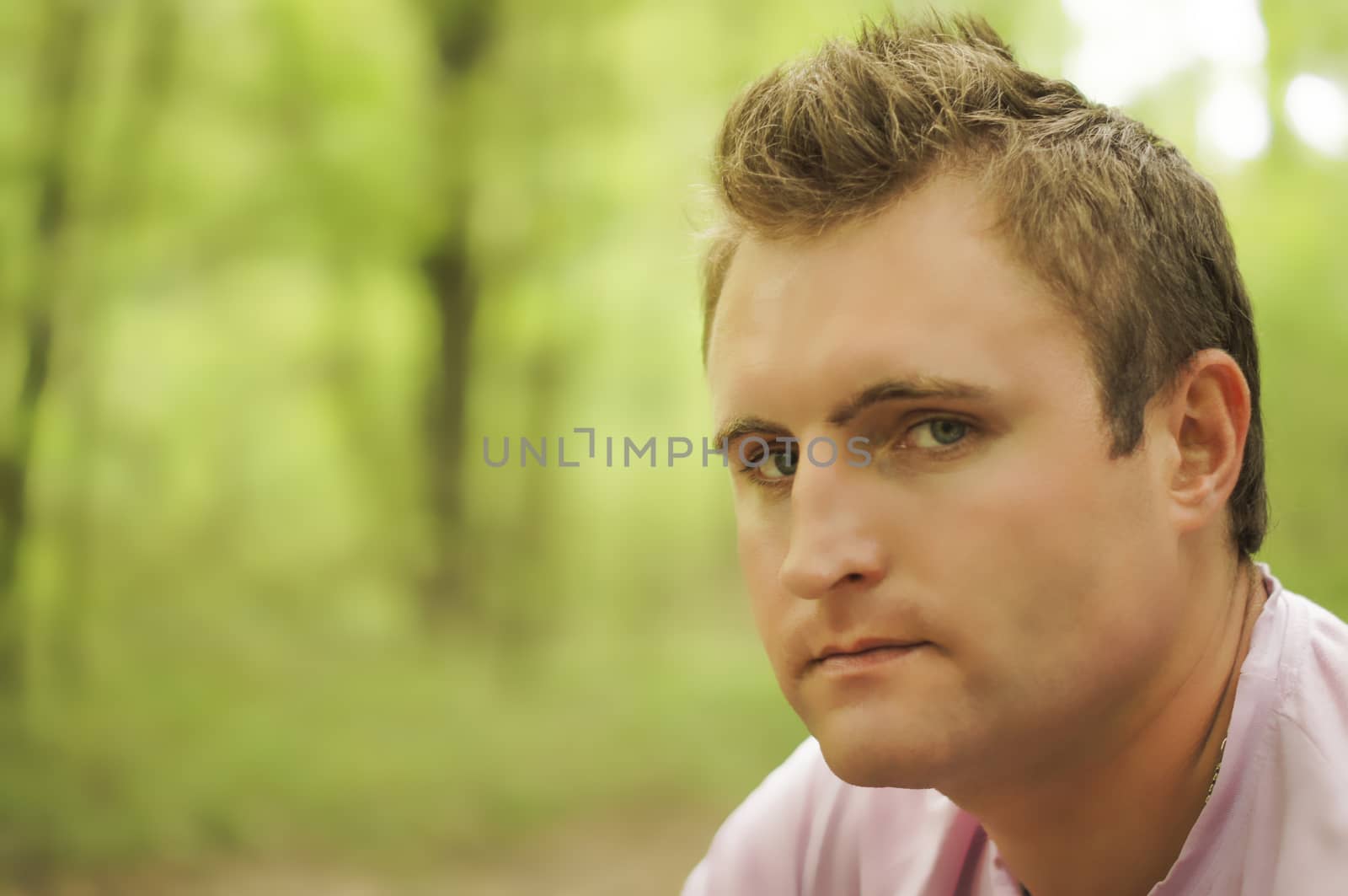 Thoughtful young man Outdoors. For your commercial and editorial use.