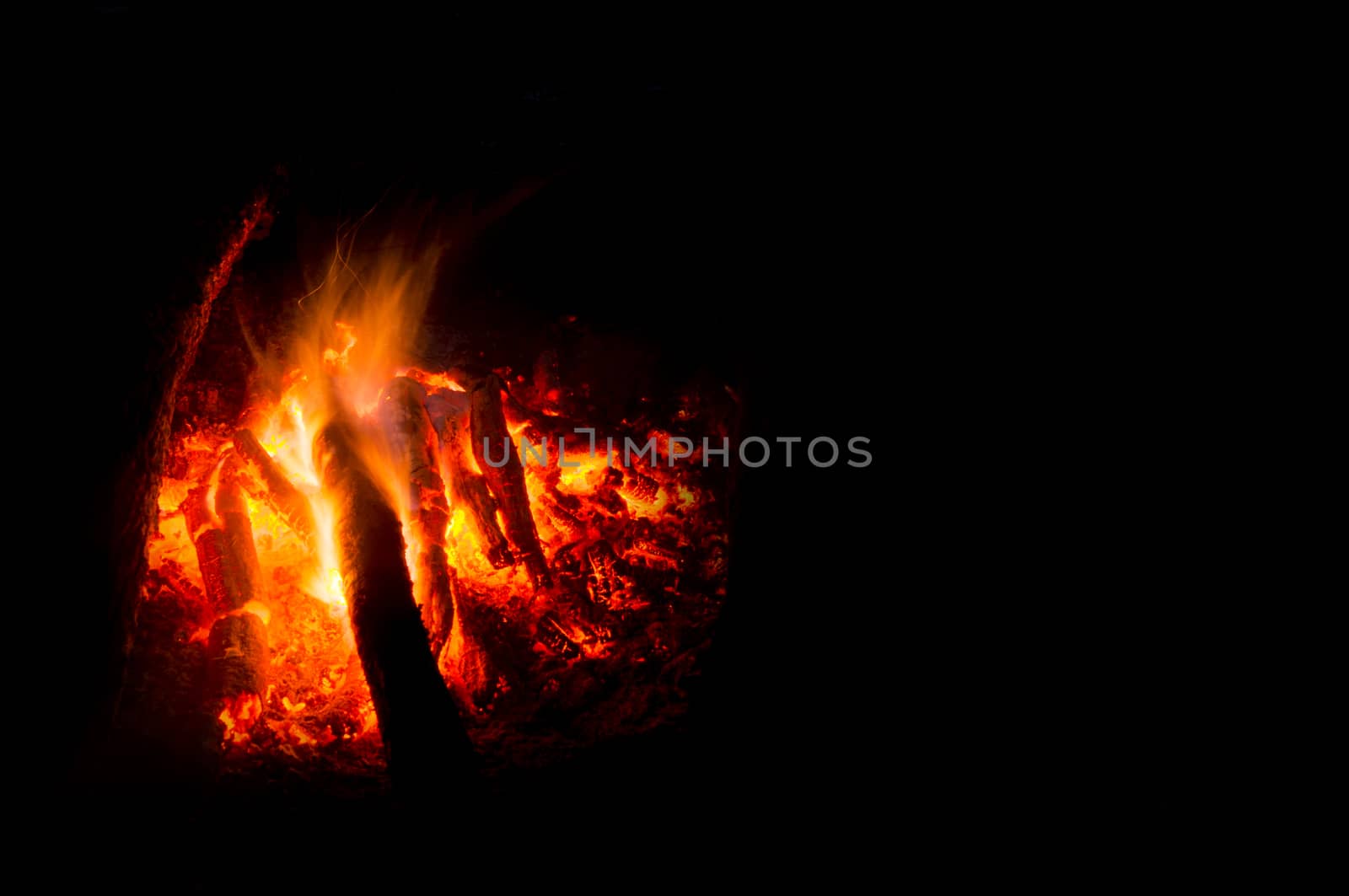 Flames of a campfire in the night by serhii_lohvyniuk