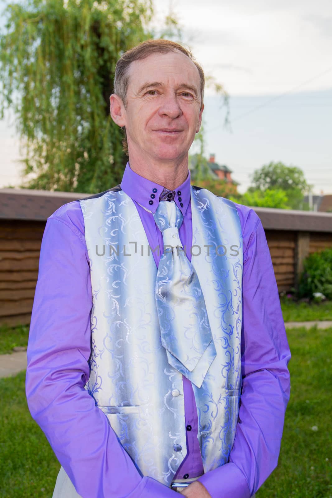 Portrait Of Man Standing Outside In Autumn Landscape. For your commercial and editorial use.