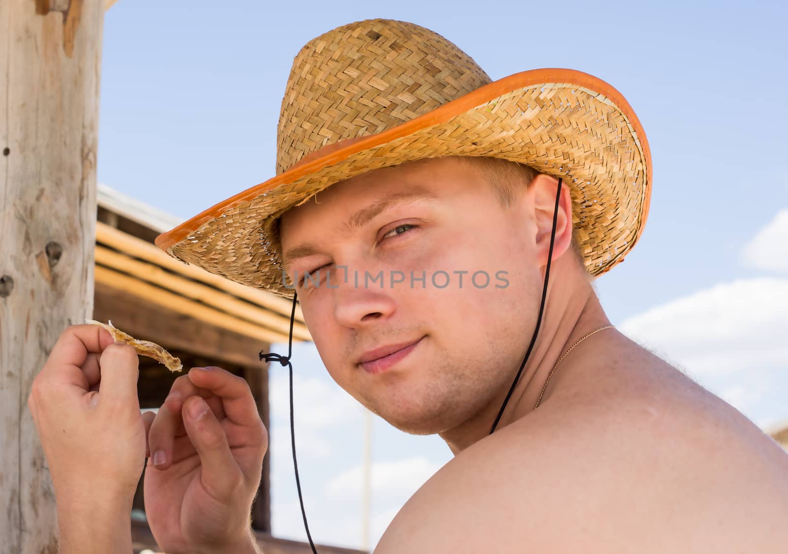 young man in a straw hat. For your commercial and editorial use.