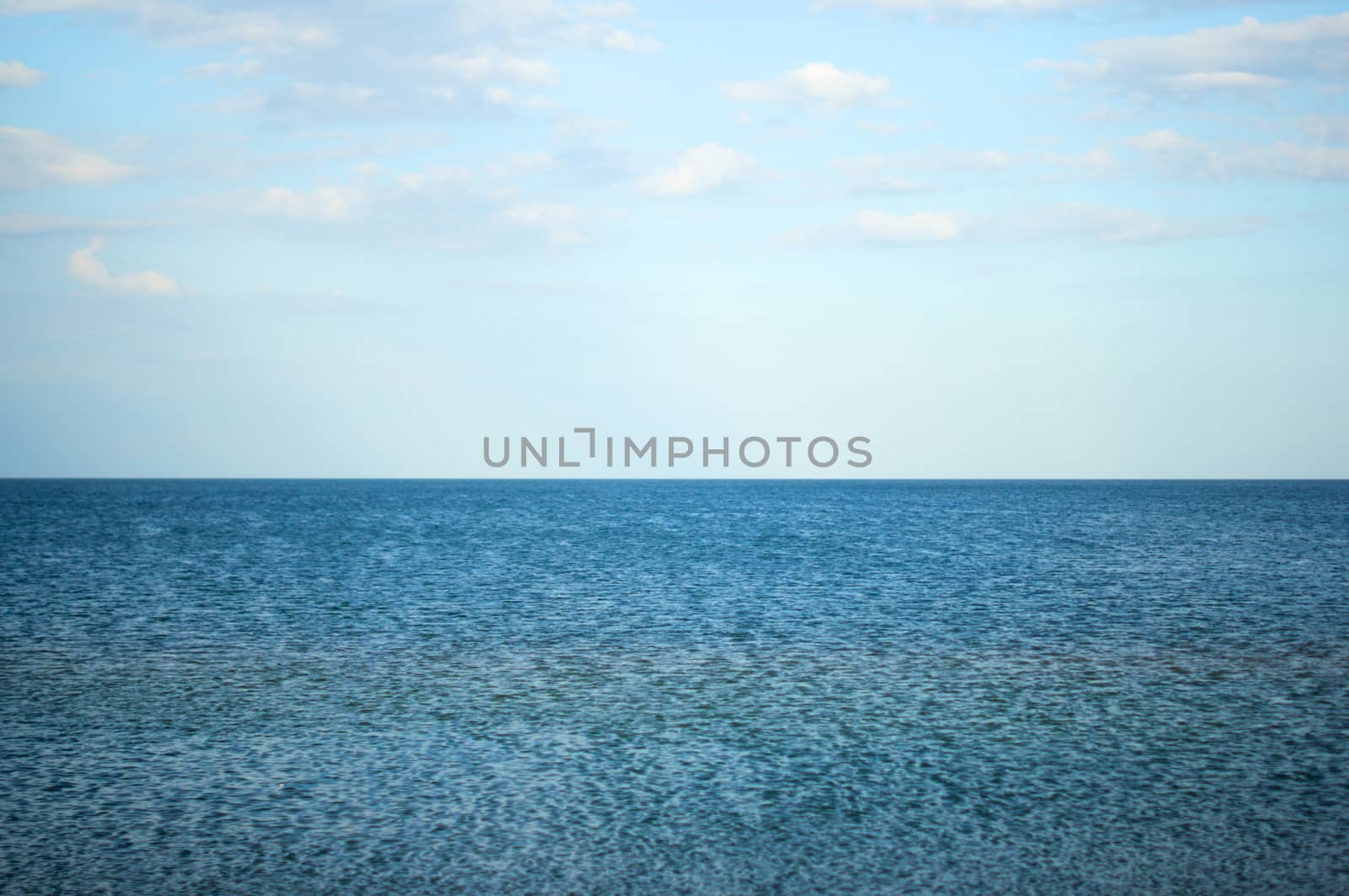 blue sea and cloudy sky over it. For your commercial and editorial use.