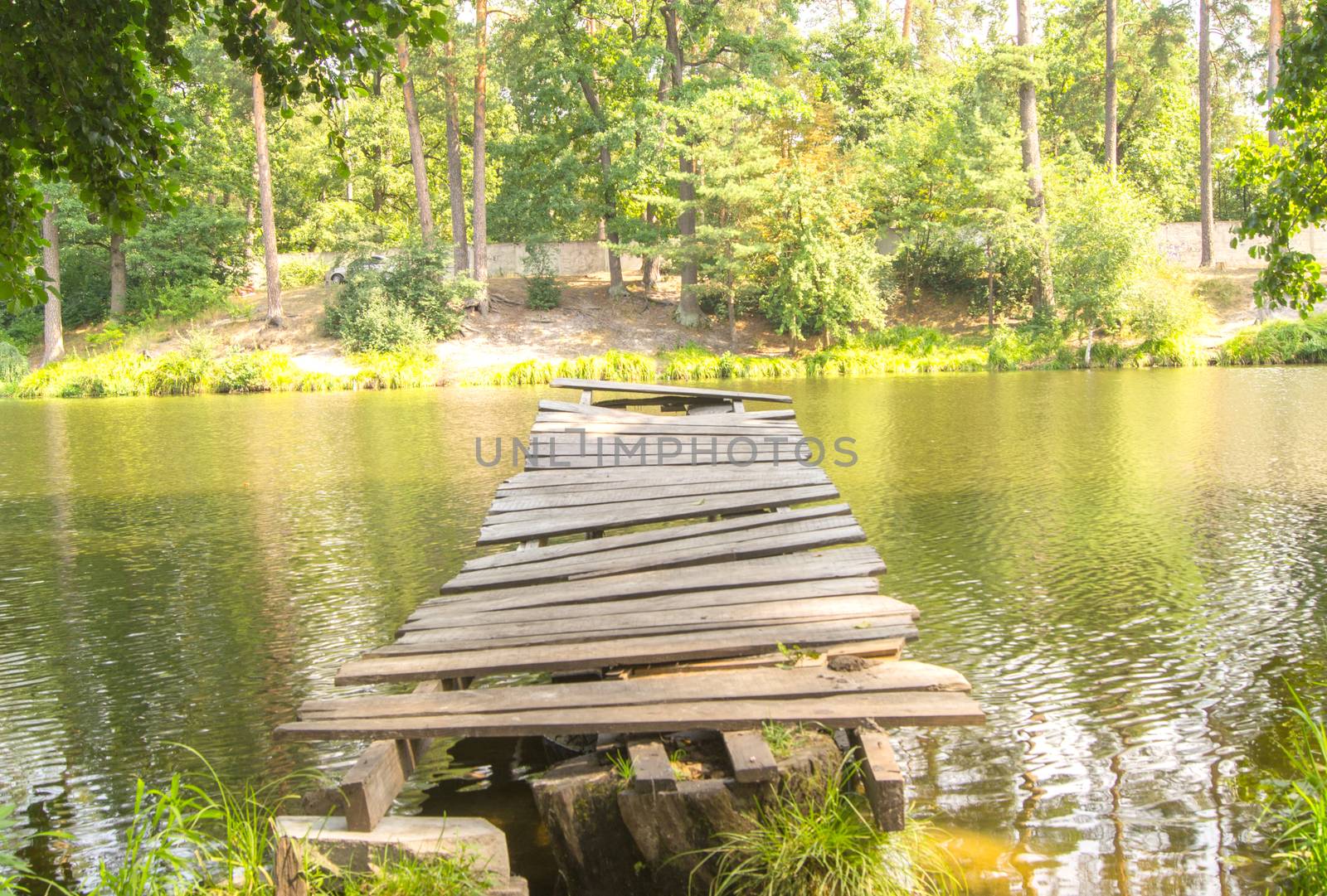 Old broken jetty at the lake. For your commercial and editorial use.