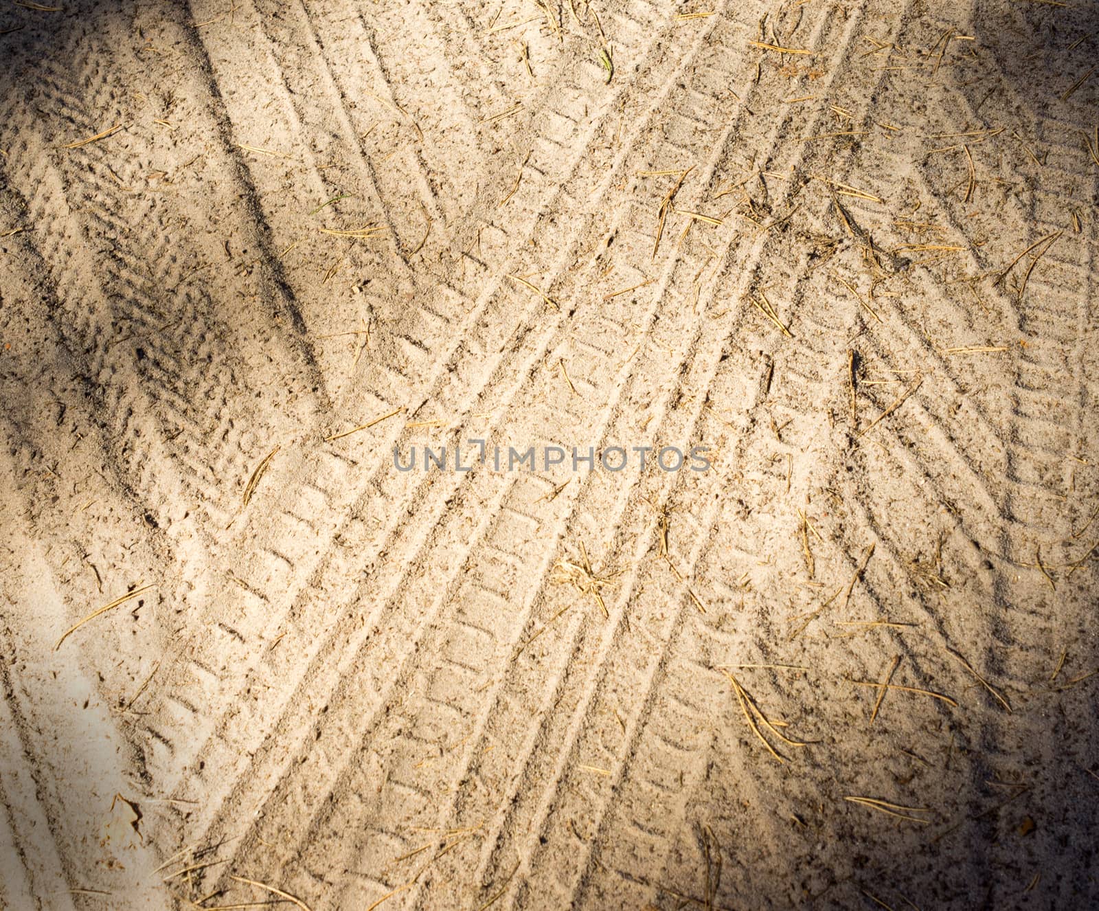 Detail of tyre tracks in sand. For your commercial and editorial use.