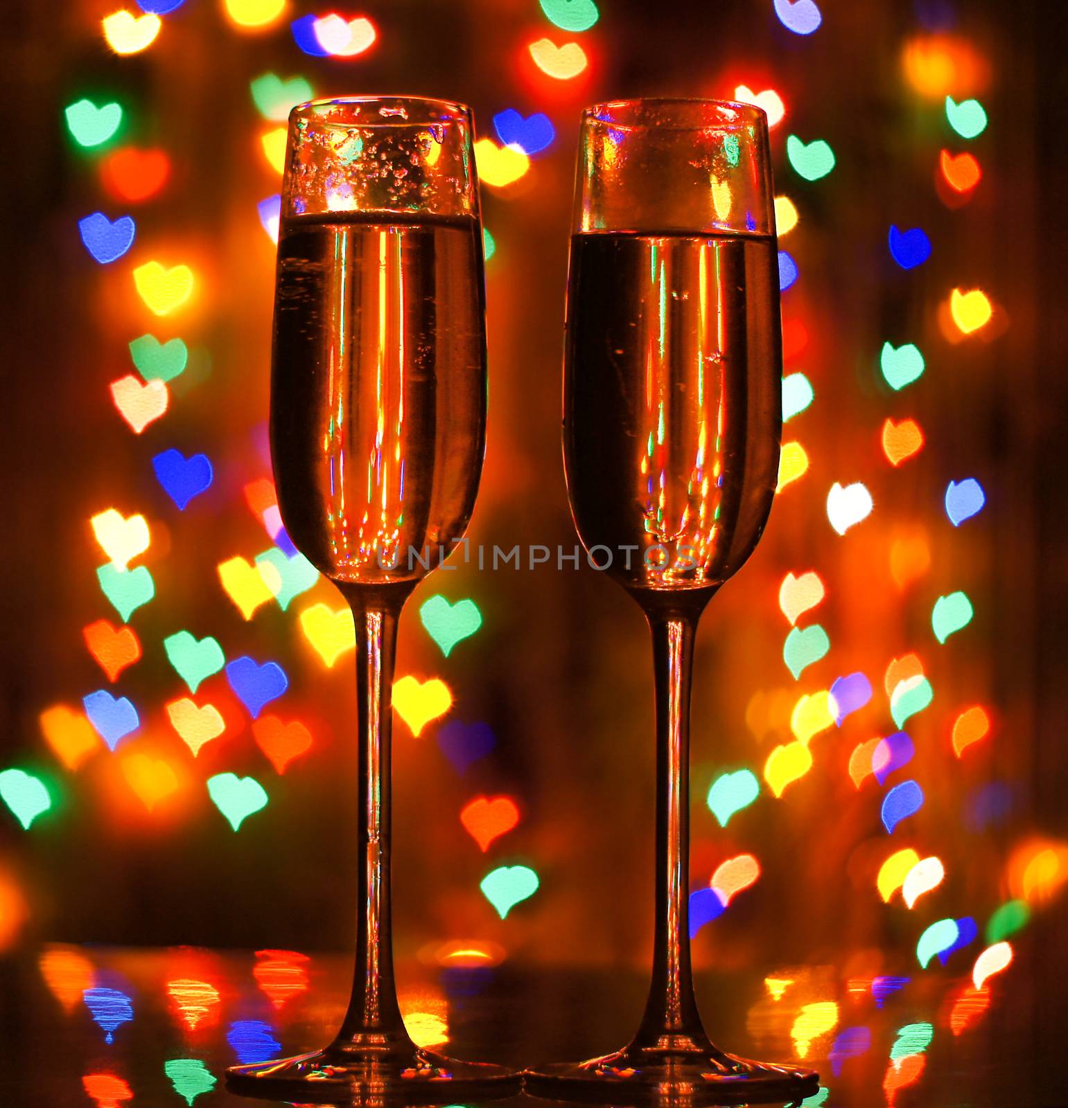 A glass of champagne on the background bokeh. For your commercial and editorial use.