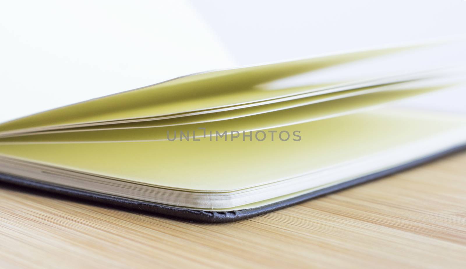 open book with the incident light from the side on desk.