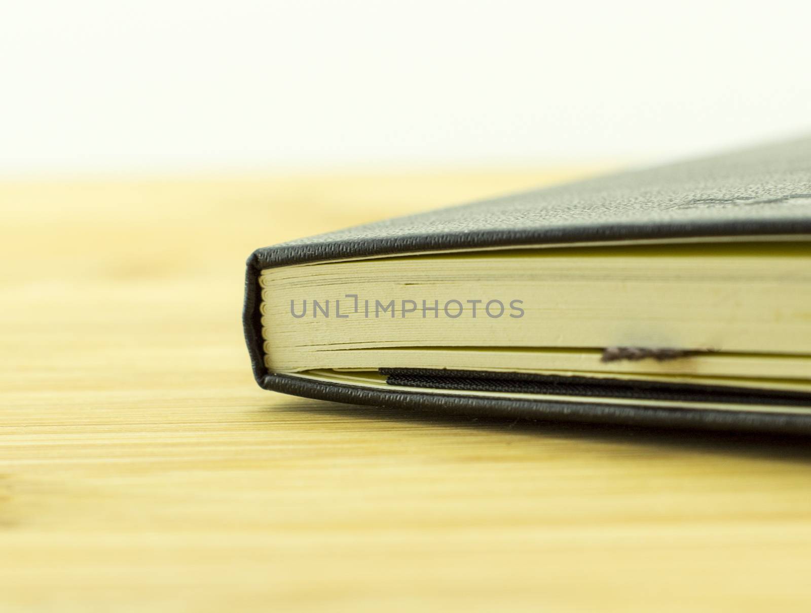 open book with the incident light from the side on desk.