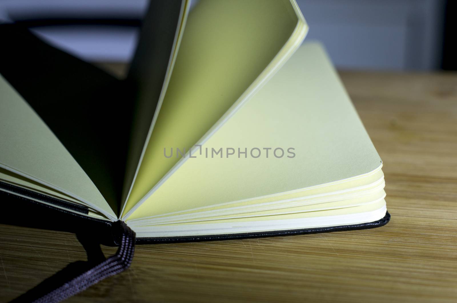 open book with the incident light from the side on desk.