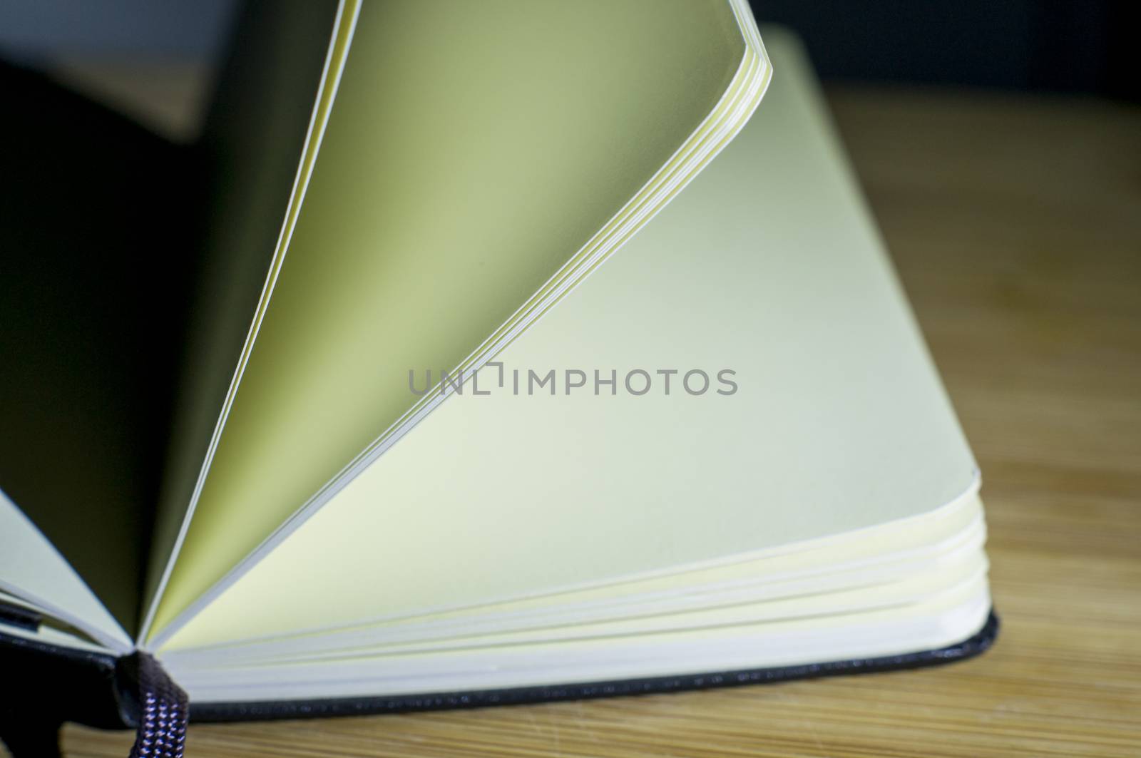 open book with the incident light from the side on desk.