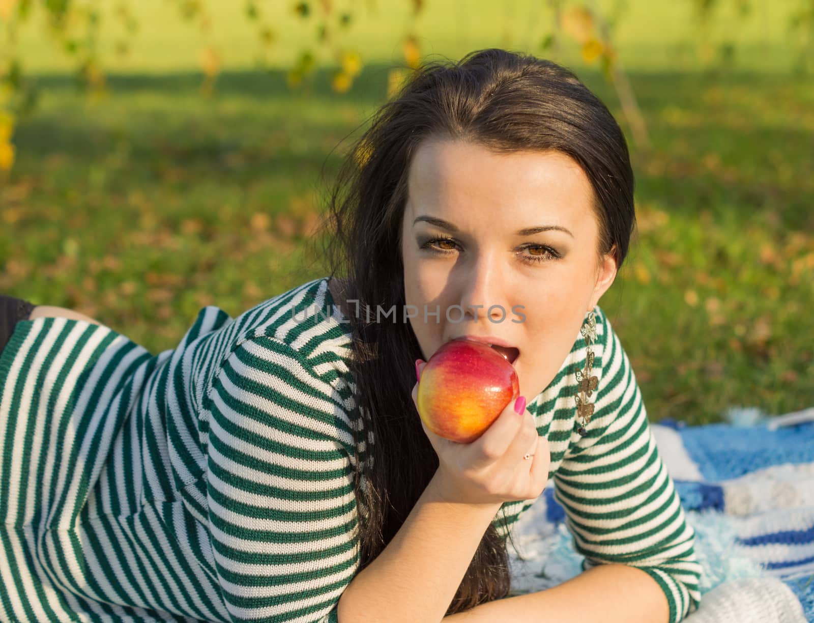 beautiful and sexy girl sitting on bench outdoors by serhii_lohvyniuk