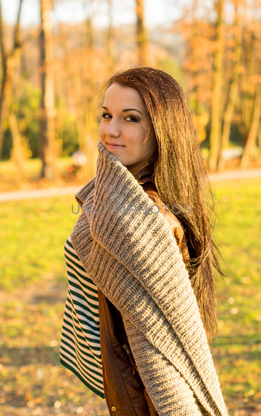 Young pretty woman in autumn park by serhii_lohvyniuk