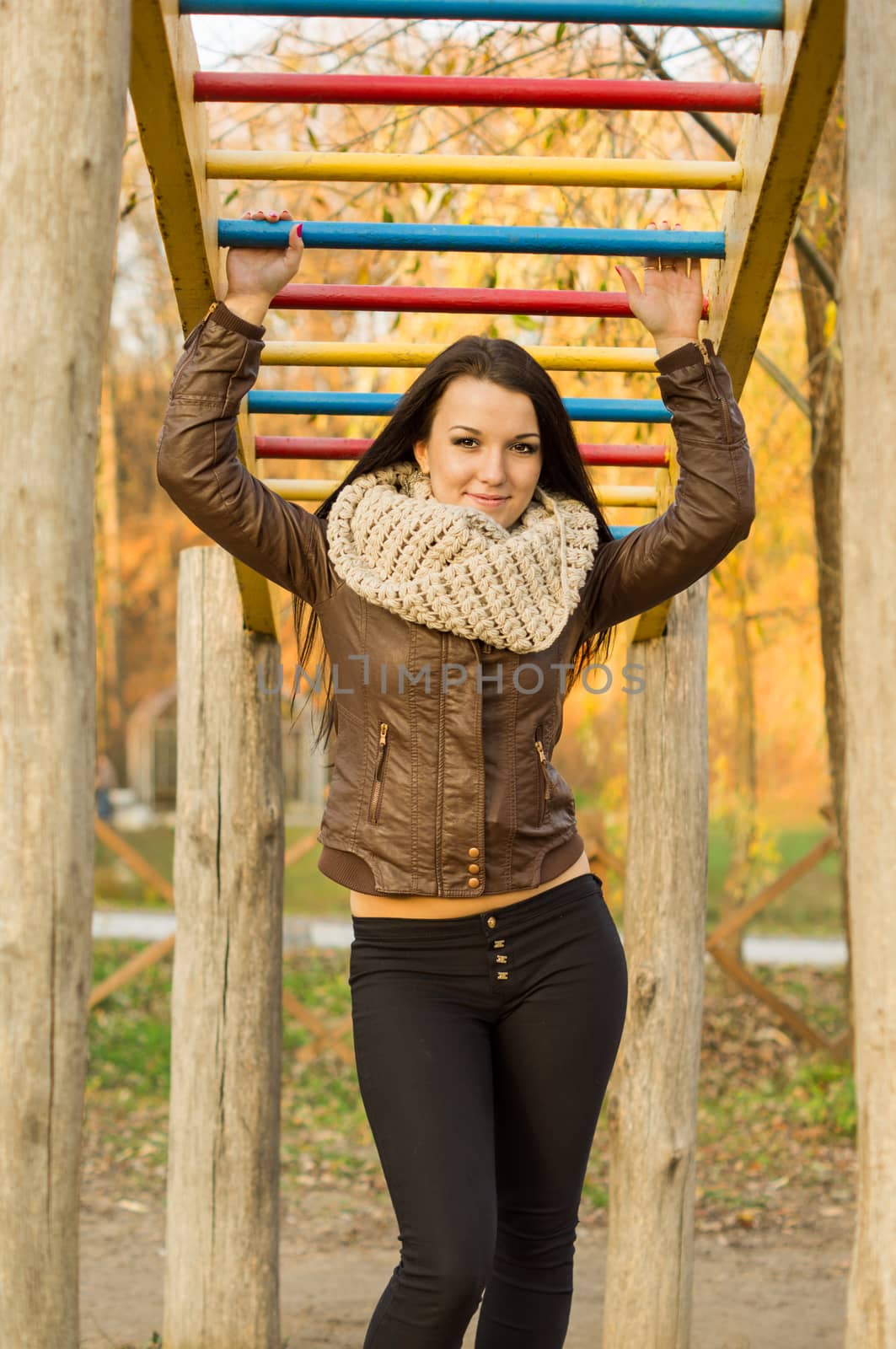 beautiful and sexy girl sitting on bench outdoors. 