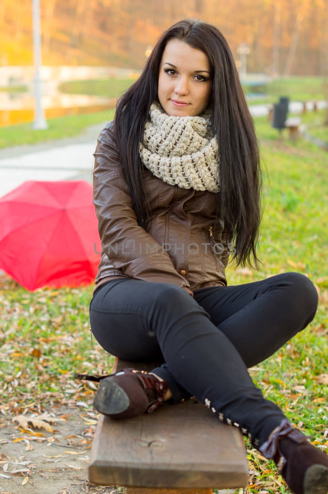 beautiful and sexy girl sitting on bench outdoors by serhii_lohvyniuk