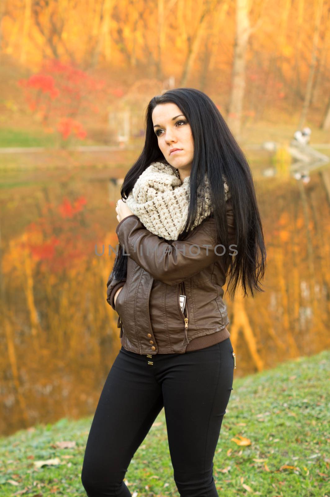 beautiful and sexy girl sitting on bench outdoors. 