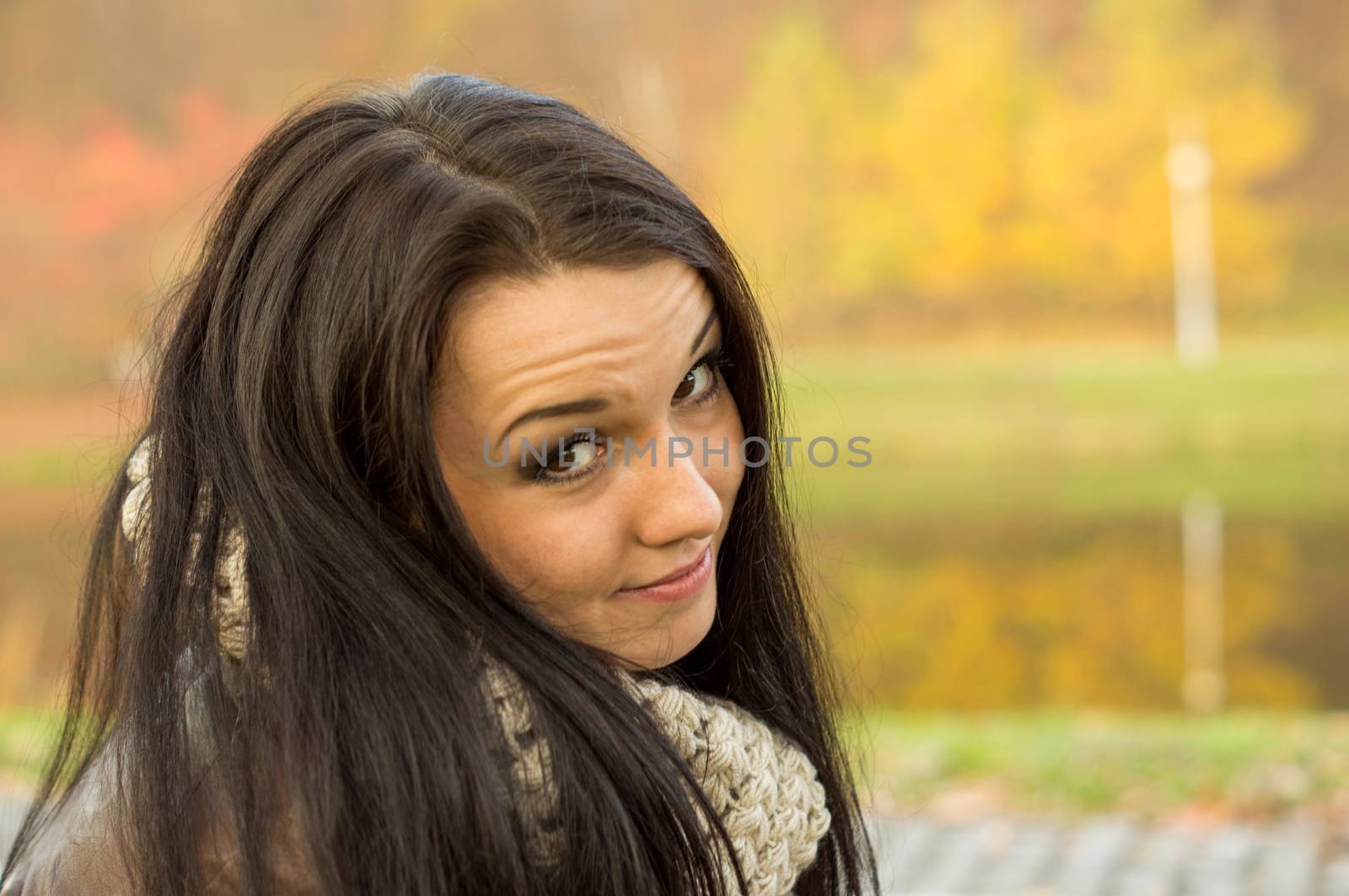 beautiful and sexy girl sitting on bench outdoors. 