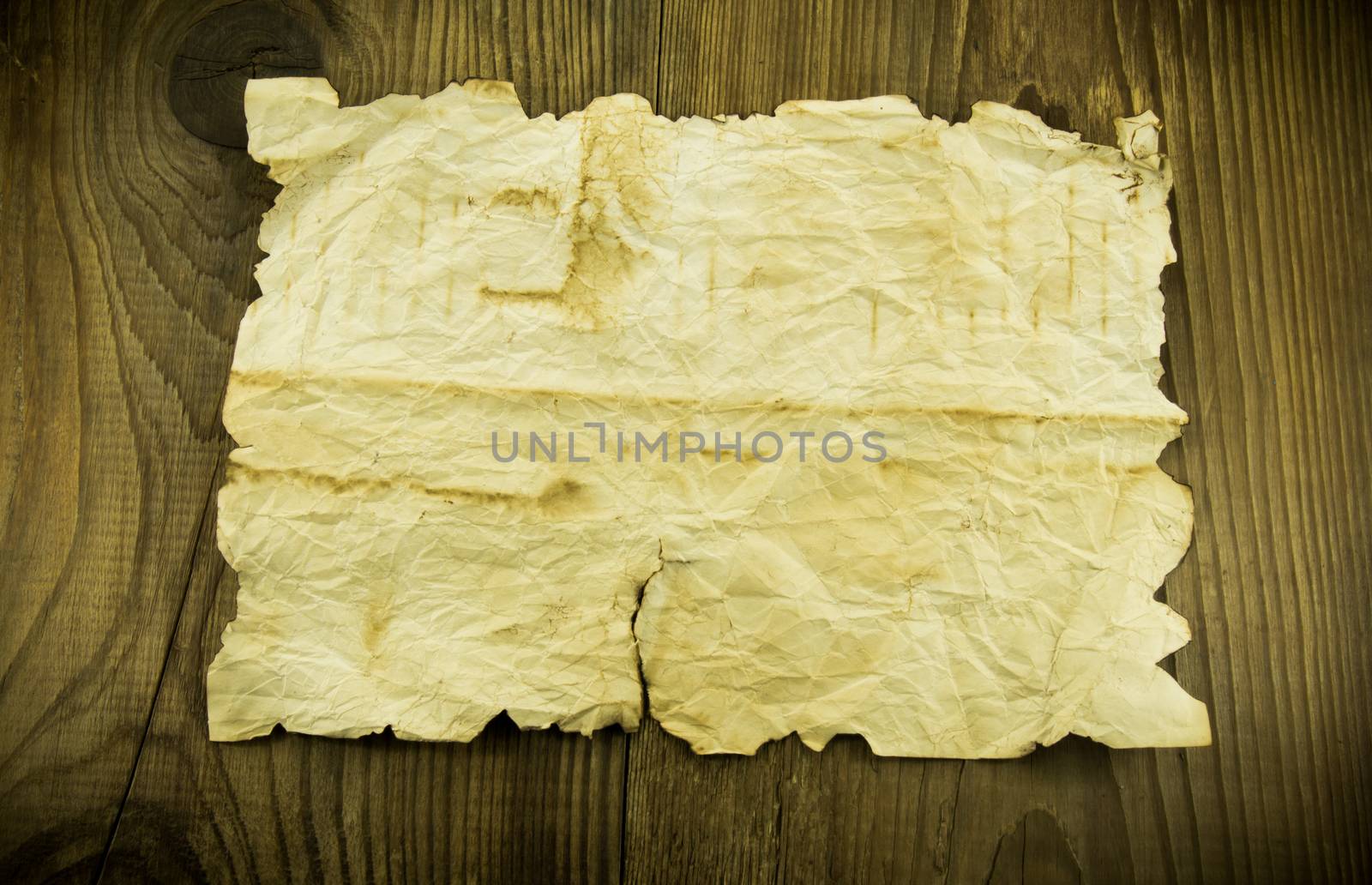 old paper on wood background by serhii_lohvyniuk