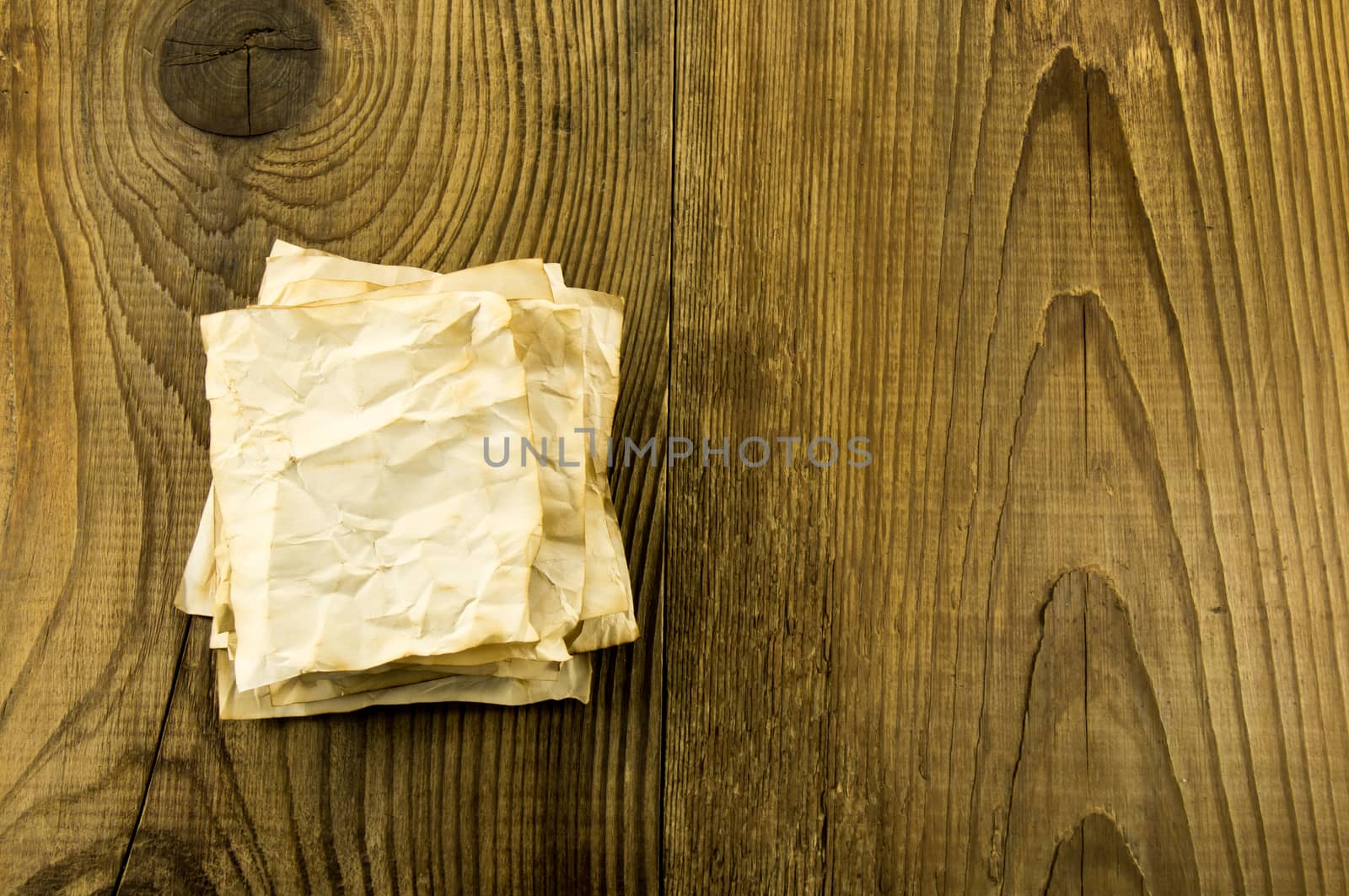 old paper on wood background by serhii_lohvyniuk