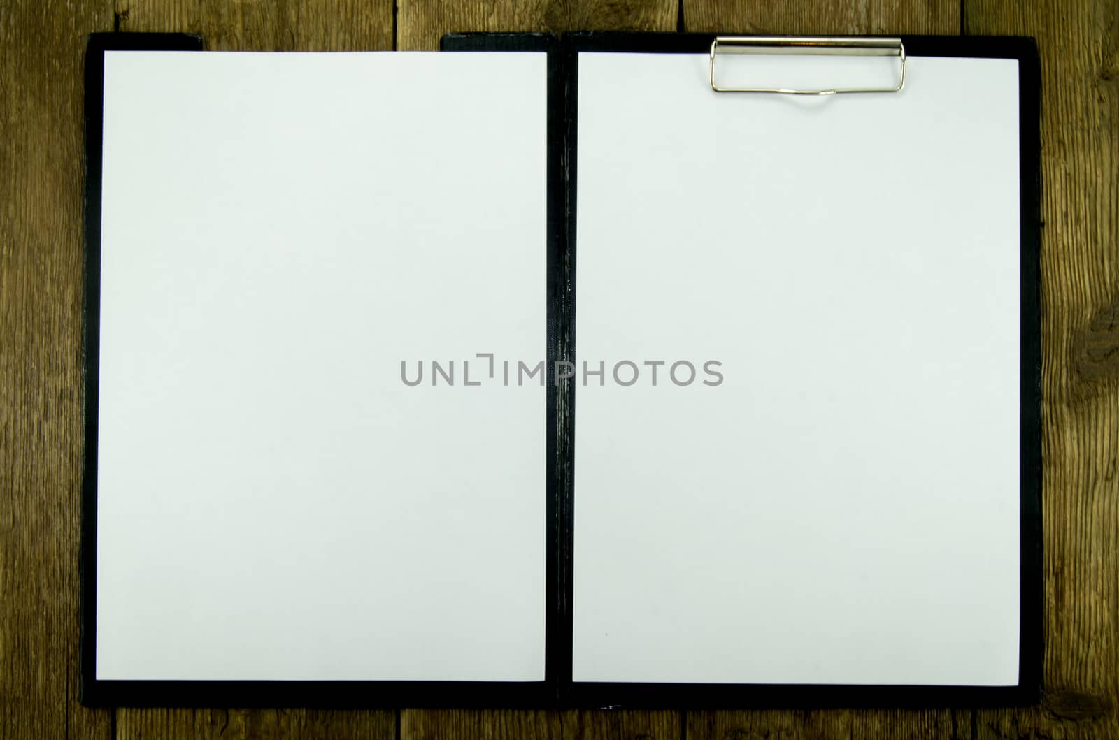 White paper on wood background. For your commercial and editorial use
