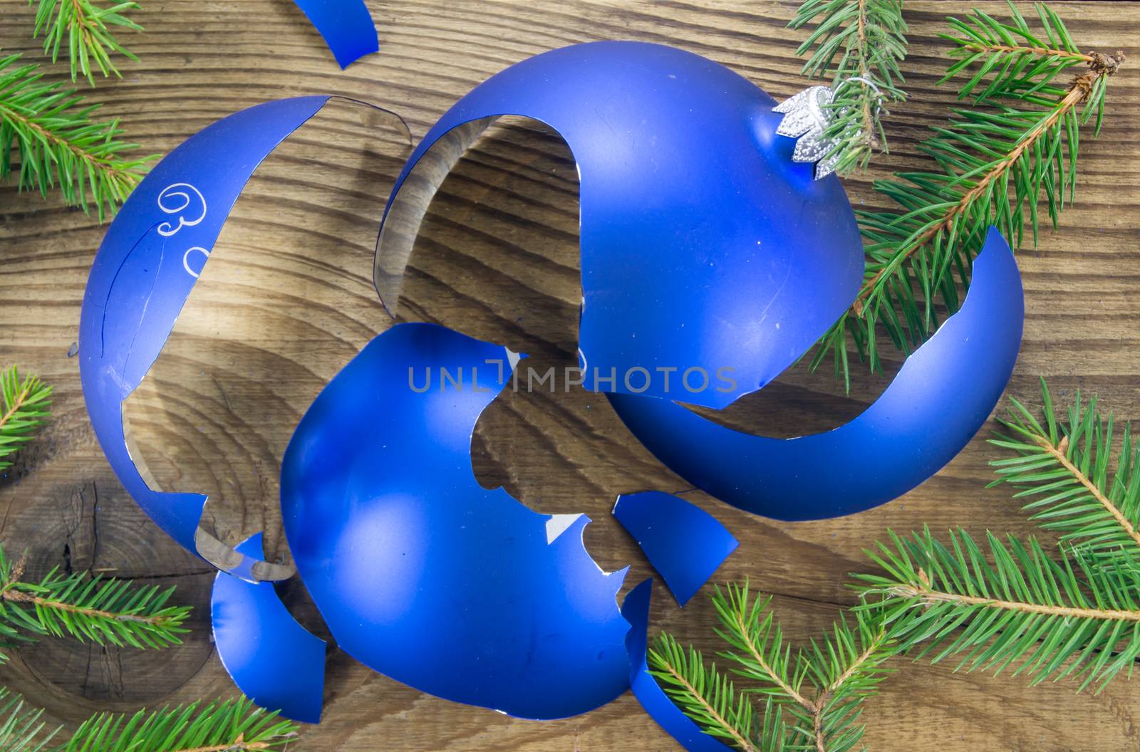 Broken Christmas Toy on wooden background by serhii_lohvyniuk
