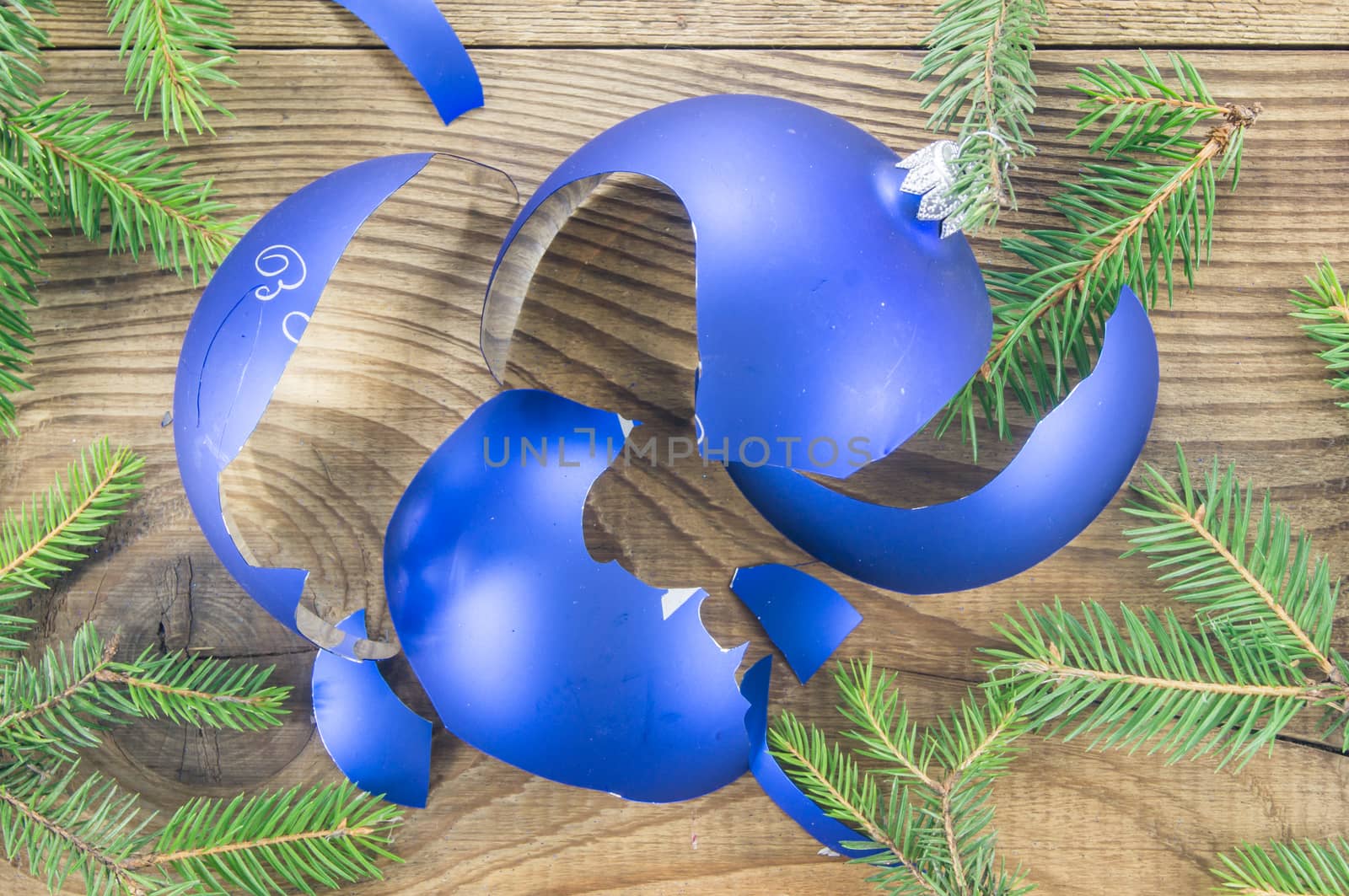 Broken Christmas Toy on wooden background by serhii_lohvyniuk