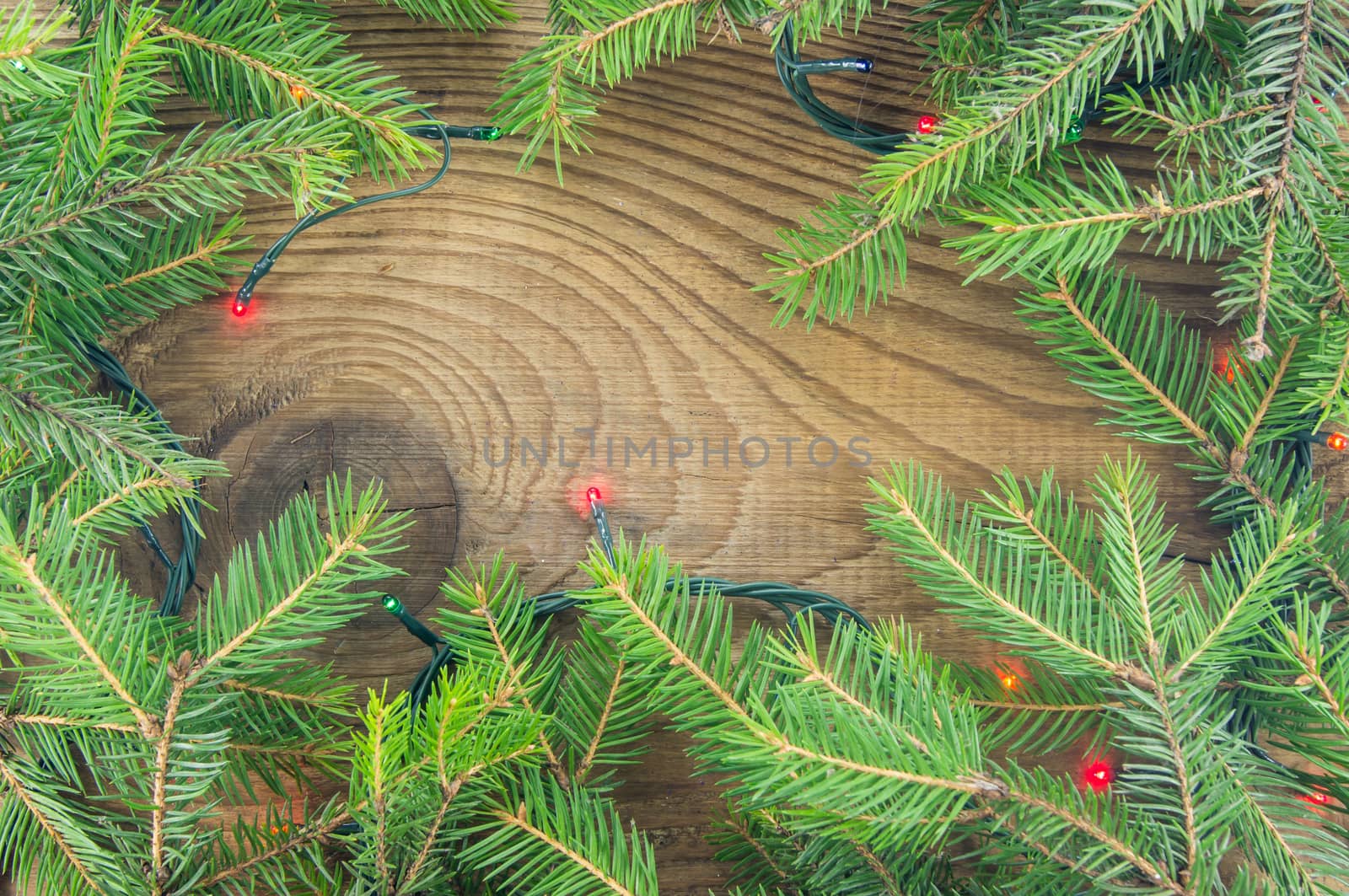 Christmas lights on wooden background. For your commercial and editorial use