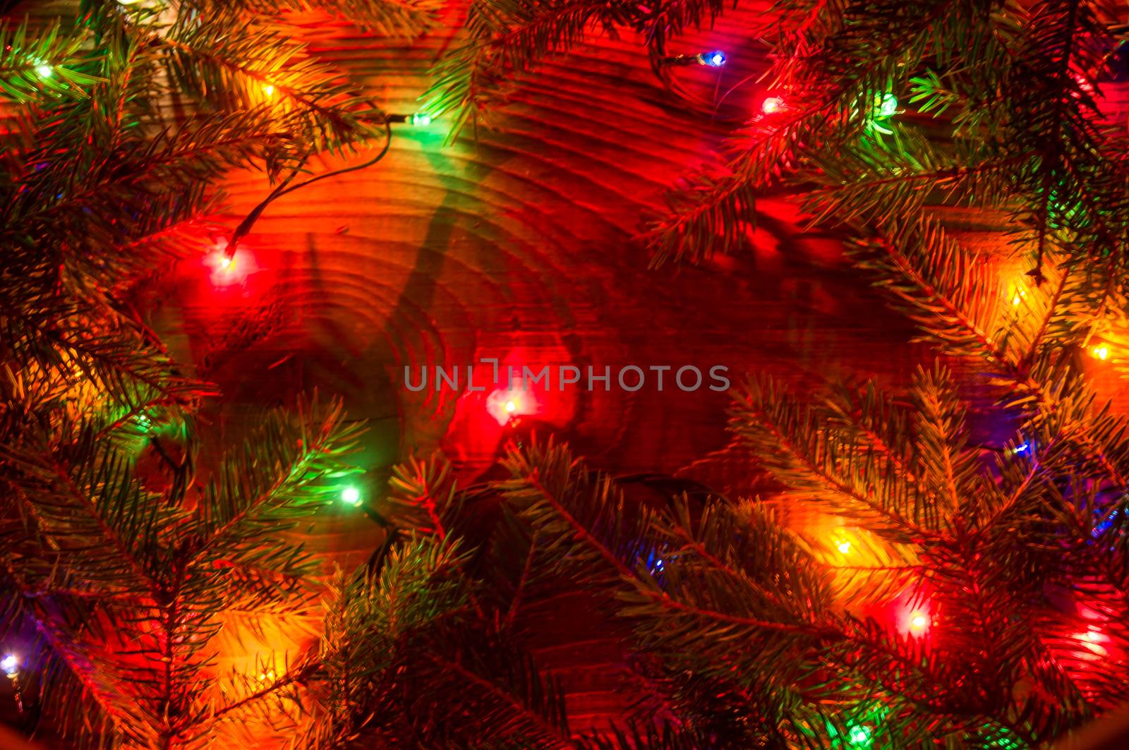 Christmas lights on wooden background. For your commercial and editorial use