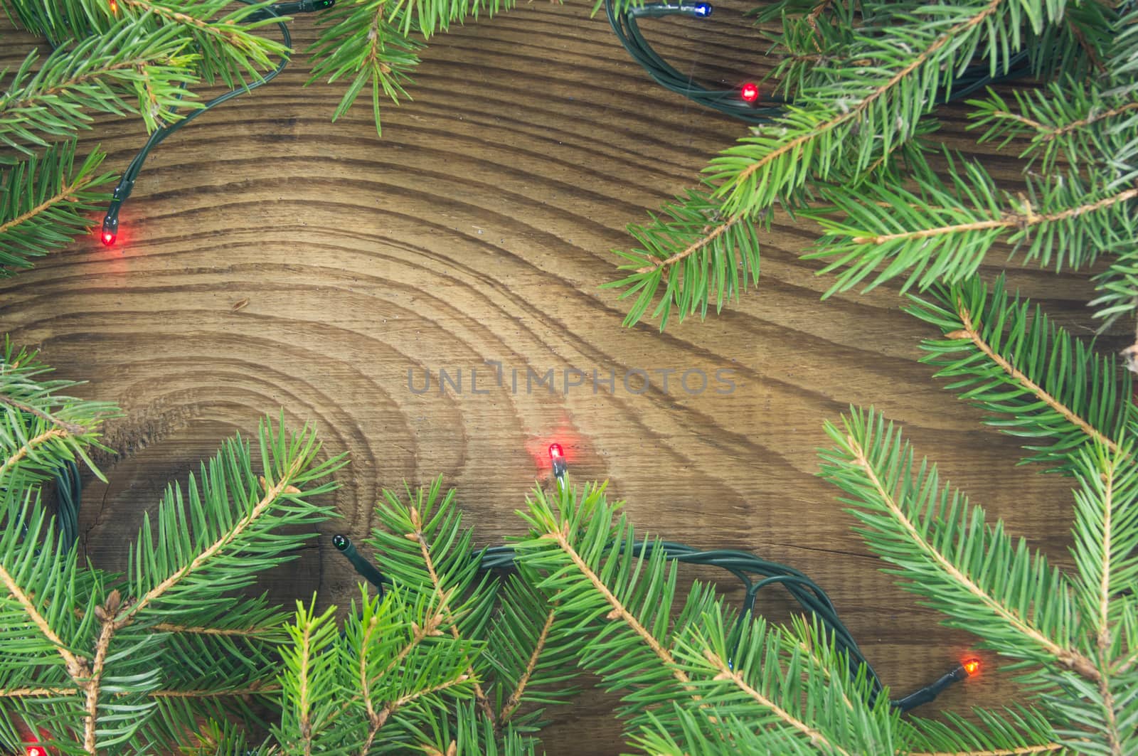 Christmas lights on wooden background by serhii_lohvyniuk