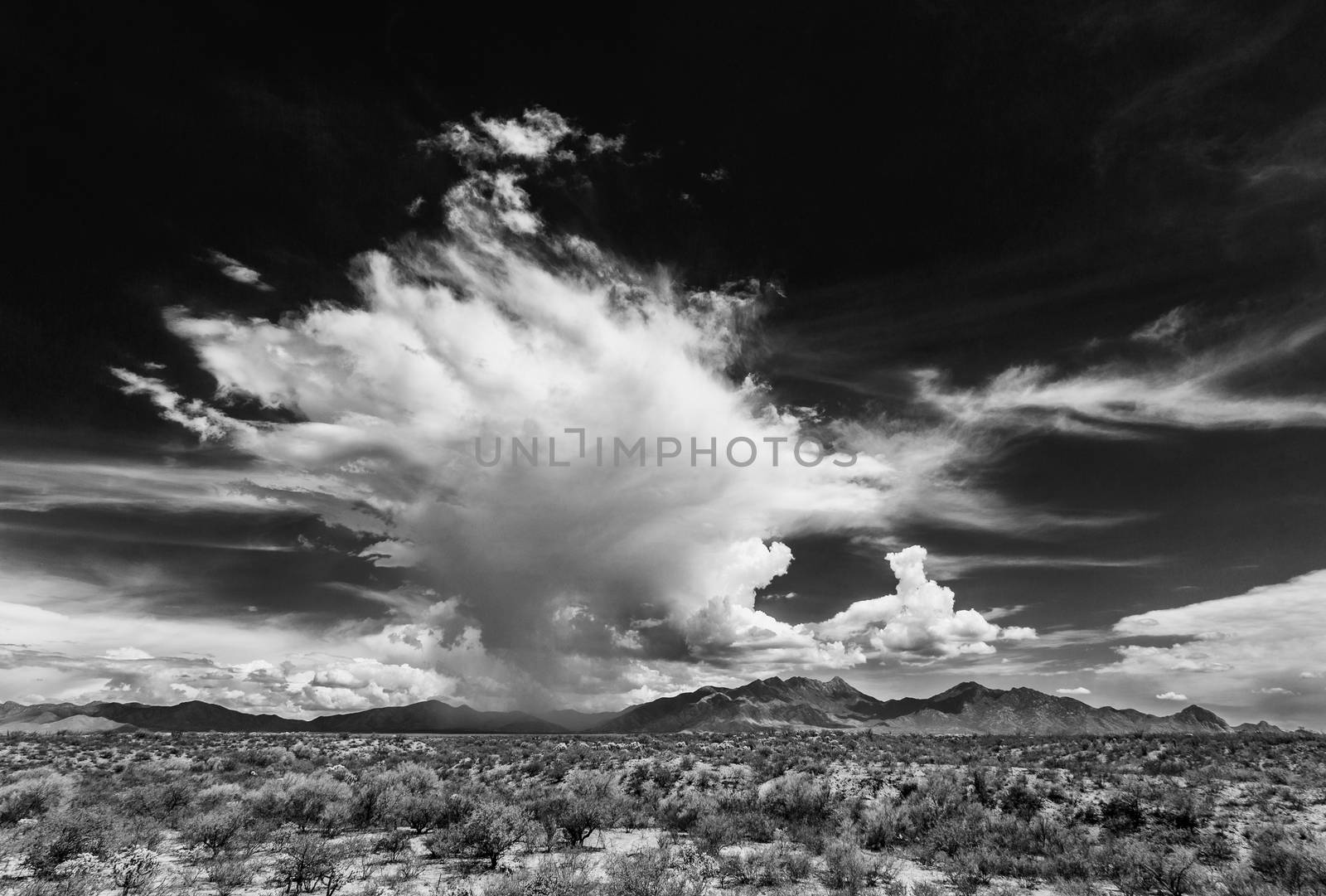 Black and white dramatic monsoon clouds over mountains