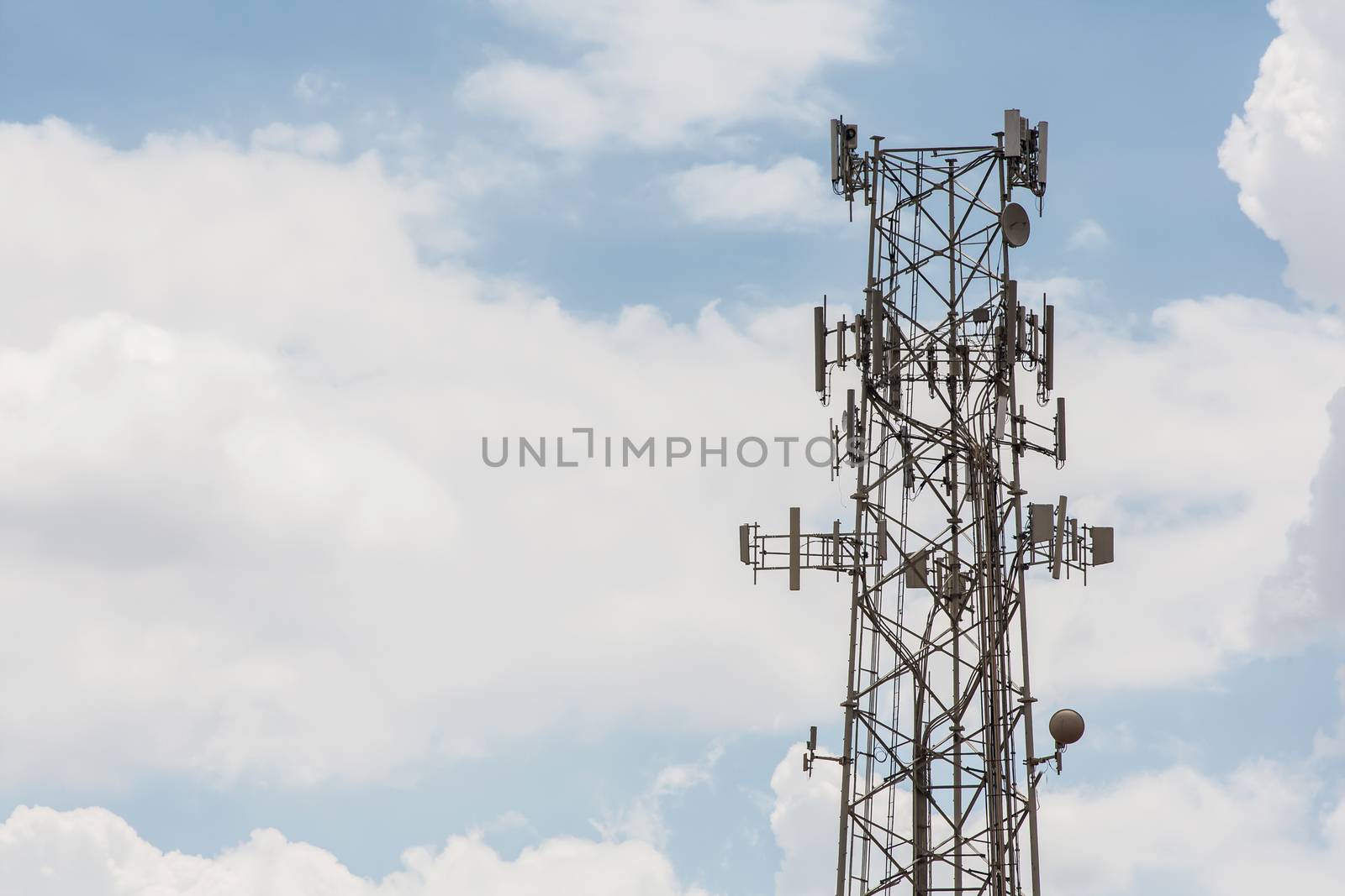 Single cell phone communication tower in sky