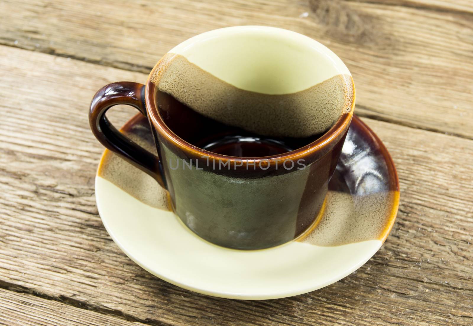 Cup of coffee on a wooden background. For your commercial and editorial use.