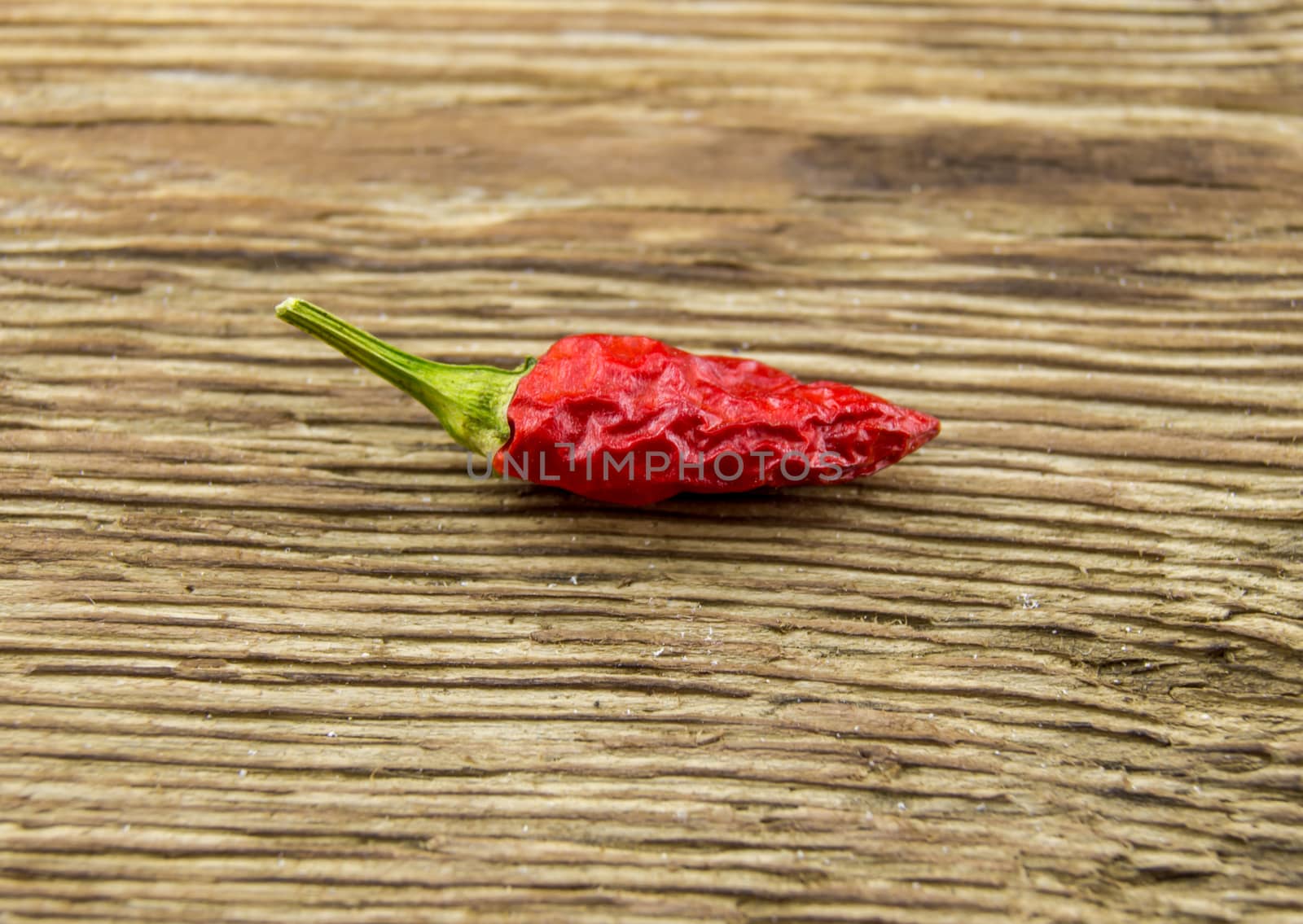 chili pepper on wood background by serhii_lohvyniuk