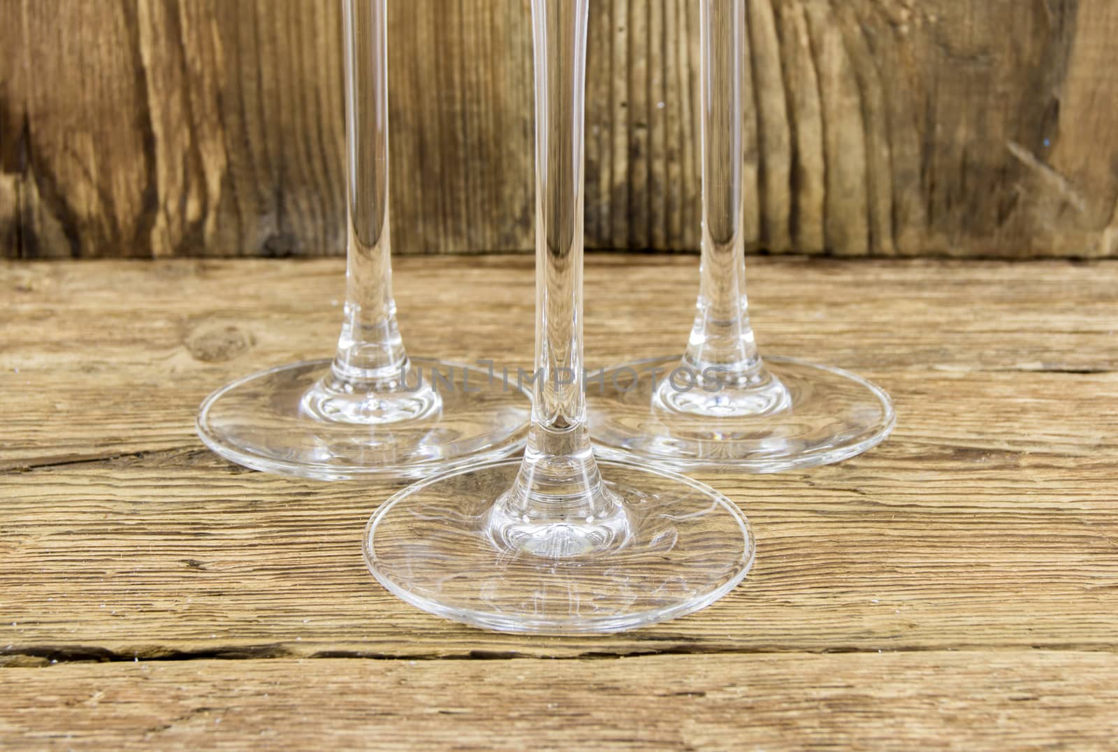 glass with champagne on a wooden background by serhii_lohvyniuk