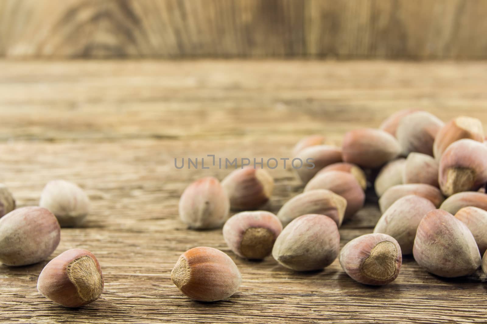 Filberts on a wooden table. Close-up shot. For your commercial and editorial use.