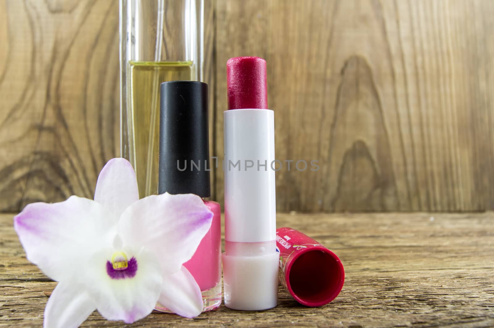 cosmetics and flowers on table wooden background. by serhii_lohvyniuk