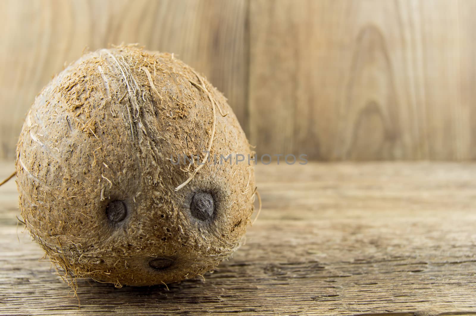 coconut and lie on a wooden background.