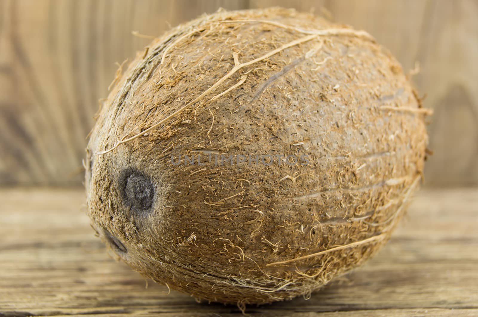 coconut and lie on a wooden background.