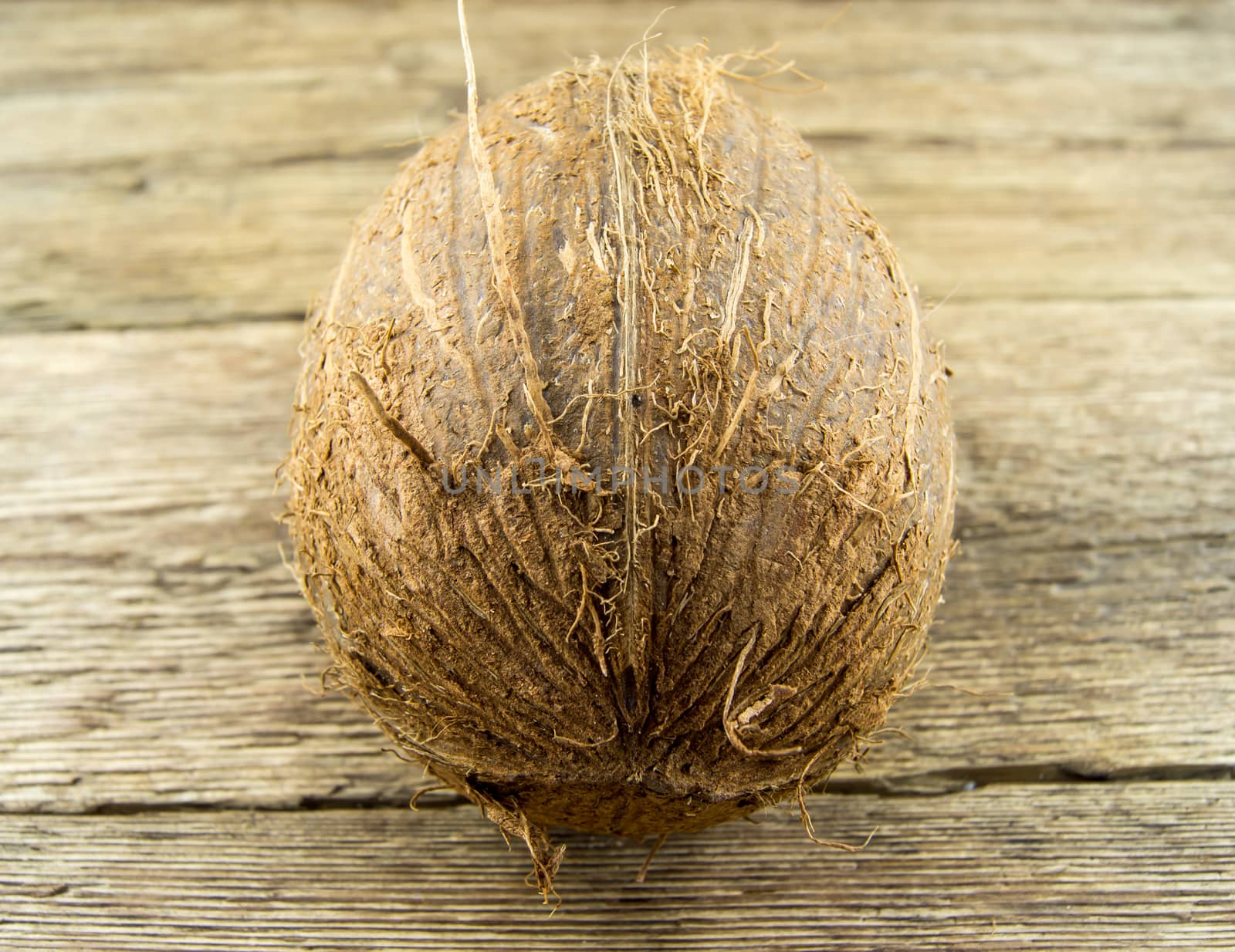 coconut and  lie on a wooden background.