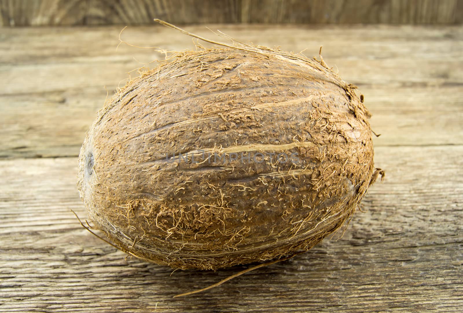 coconut and  lie on a wooden background.