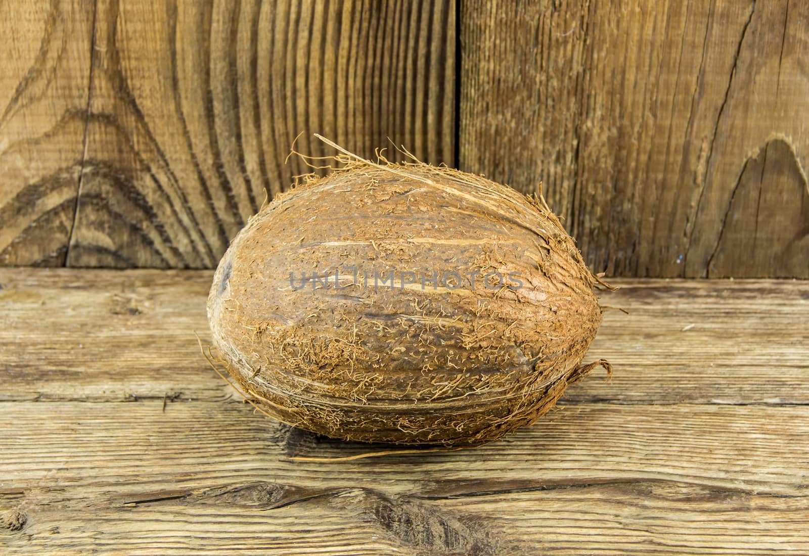 coconut and  lie on a wooden background.